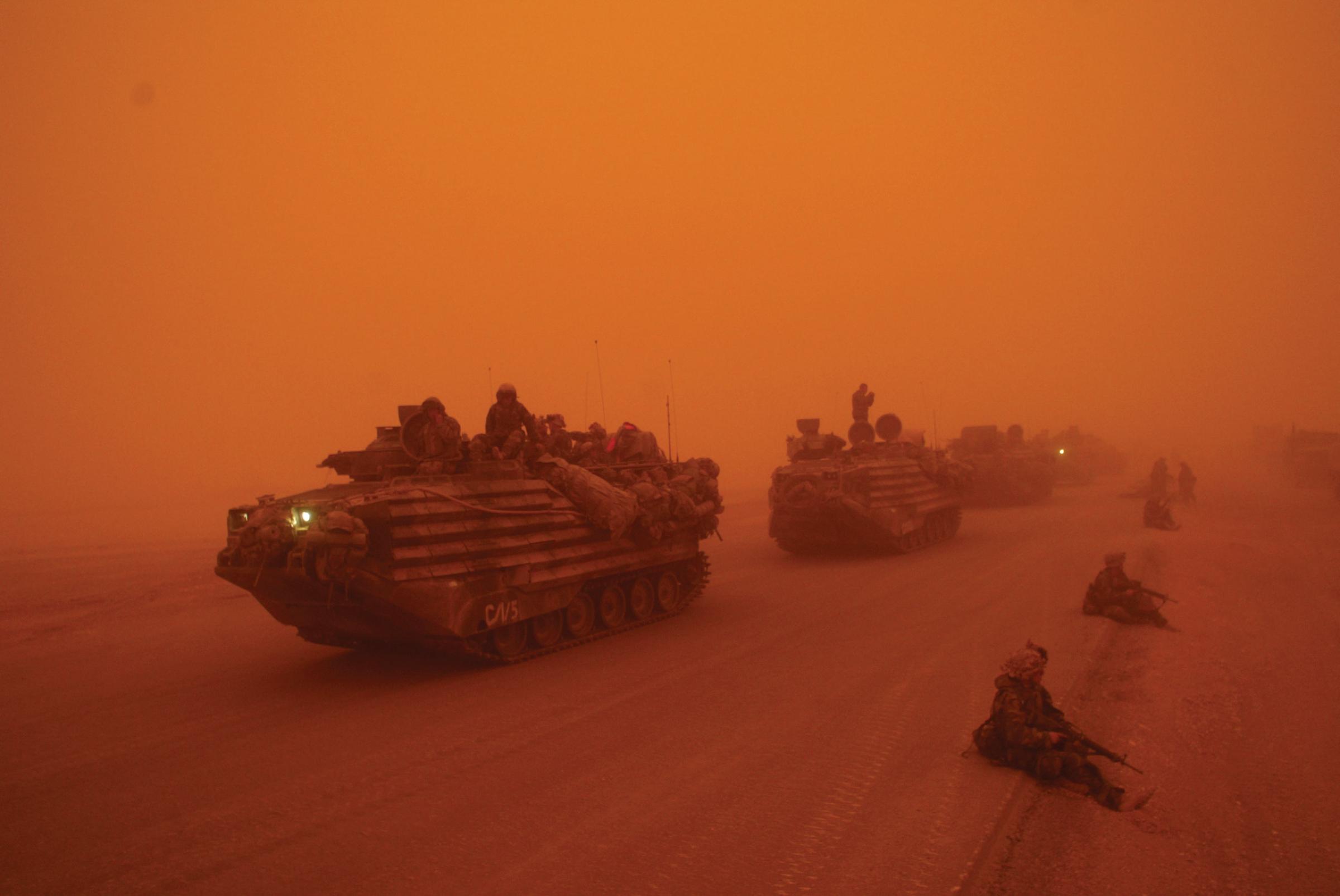 A severe sandstorm blankets a convoy from the Headquarters Battalion of the 1st Marine Division north of the Euphrates River in Iraq.