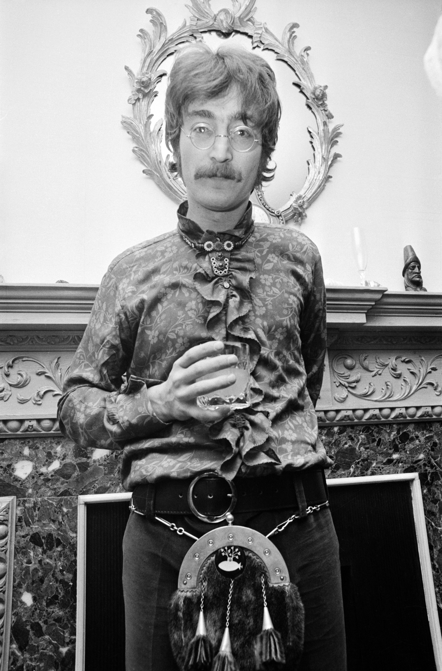 John Lennon wearing a frilly shirt and a sporran at the press launch for the Beatles' new album 'Sergeant Pepper's Lonely Hearts Club Band', held at Brian Epstein's house at 24 Chapel Street, London, May 19, 1967.