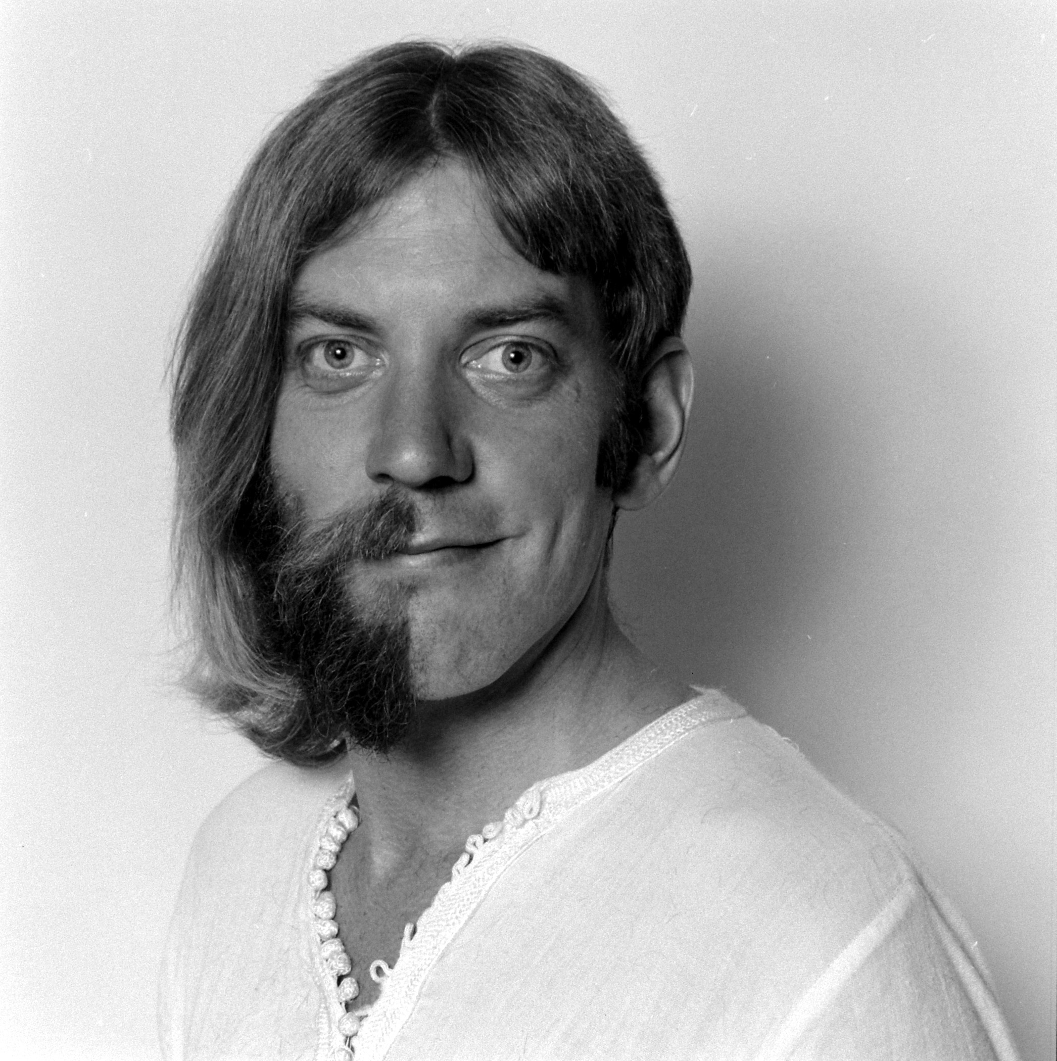 Humorous portrait of half shaved actor Donald Sutherland.
