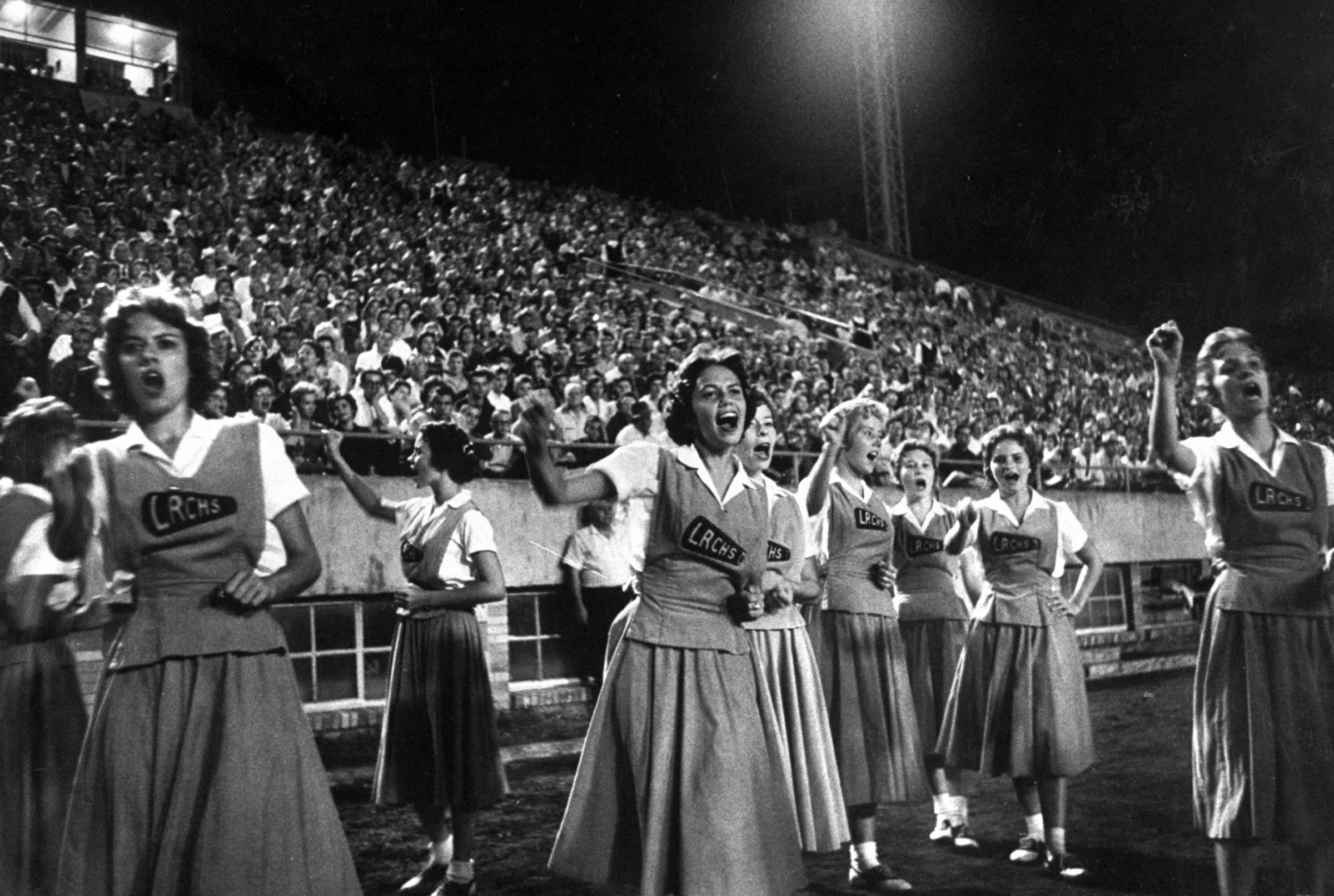 Cheerleaders at Little Rock high school game with Louisiana high school team, 1958.