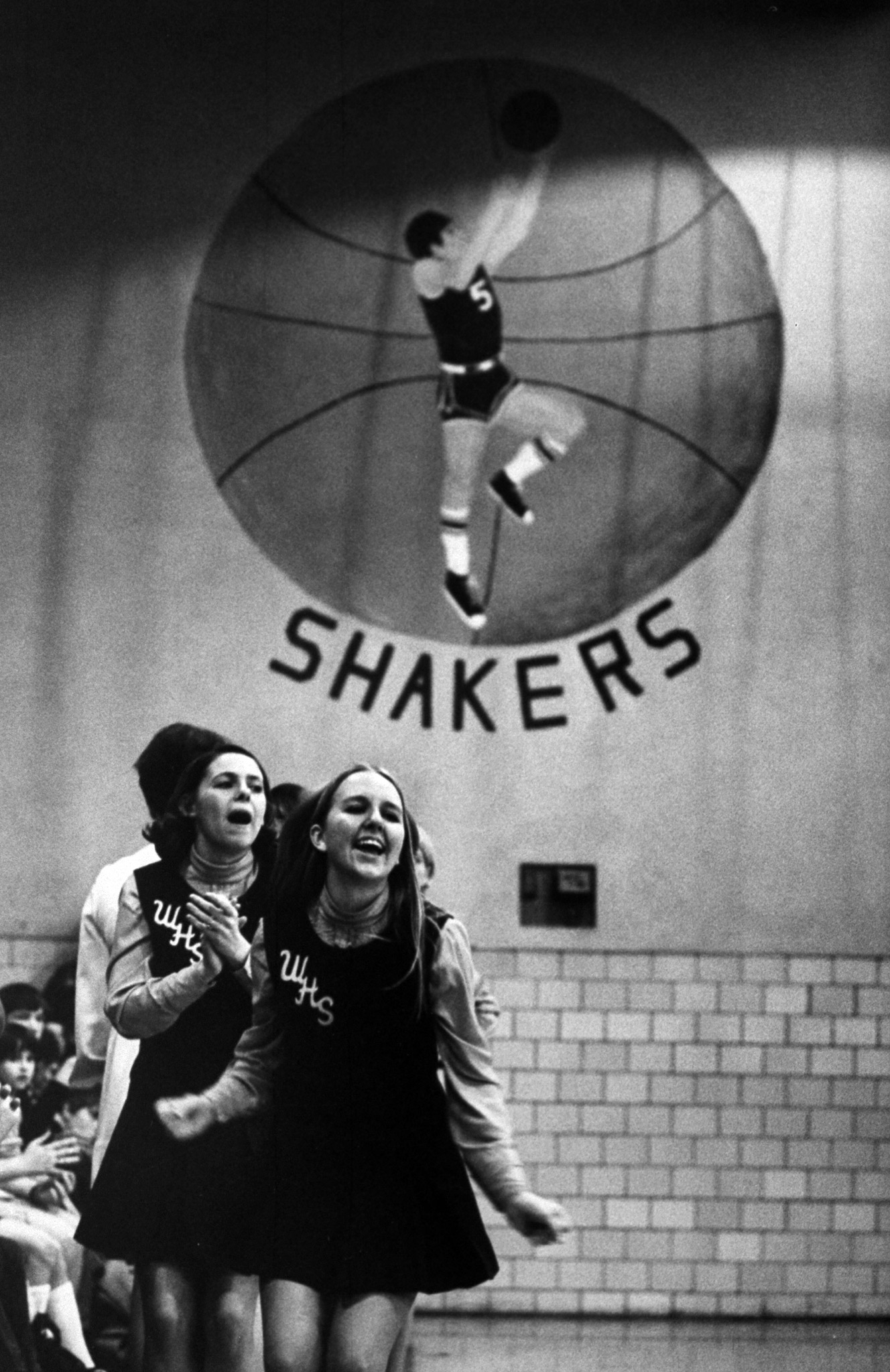 Cheerleaders cheering for a high school basketball game, 1971.