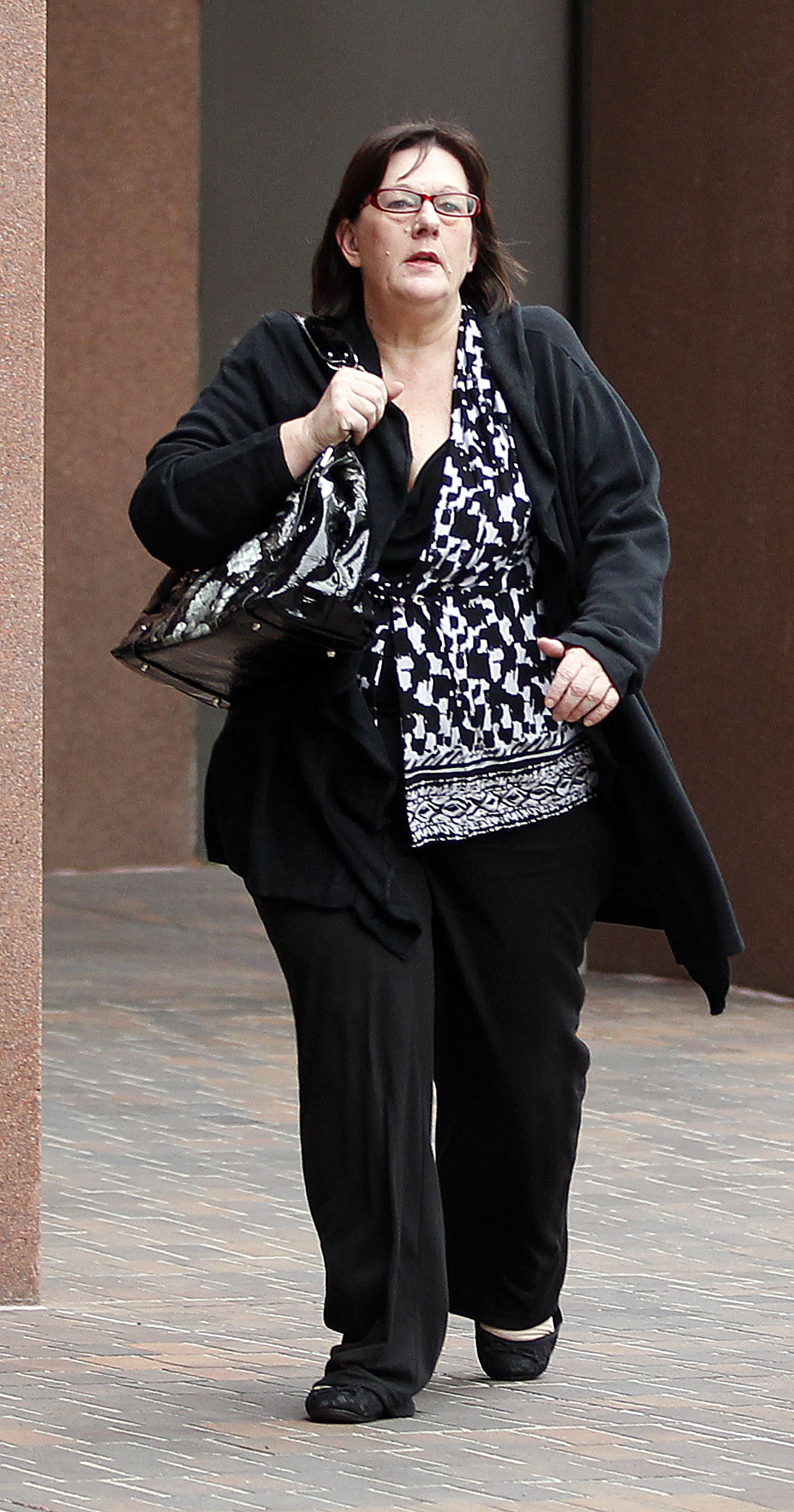 Carla Chambers, arrived at Federal Court downtown,  she and Theresa Erickson were being sentenced for their roles in a baby-selling surrogacy case in San Diego, Calif., on Feb 24, 2012. (John Gastaldo—Zuma)