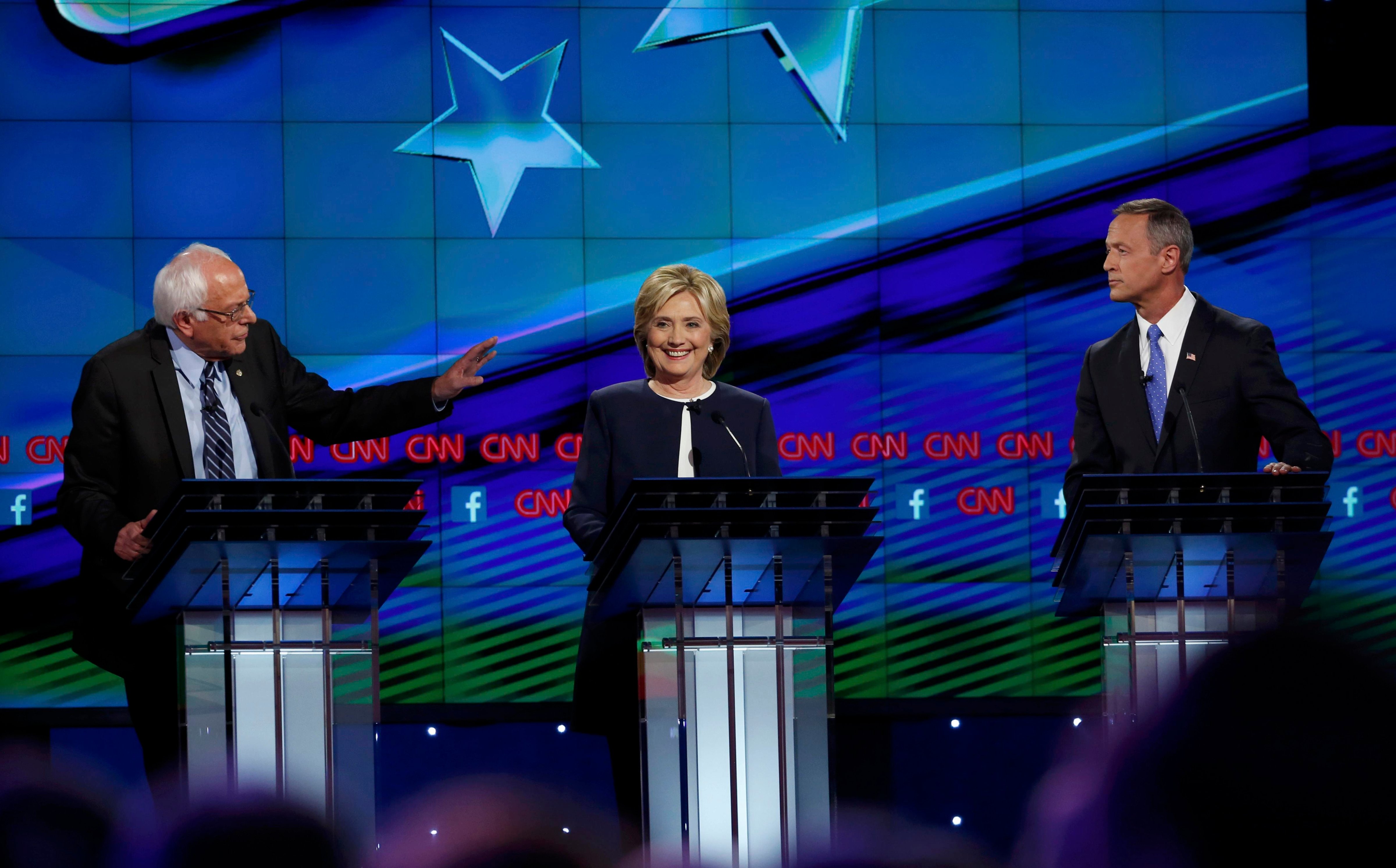 Democratic presidential candidates U.S. Senator Bernie Sanders (L), former Secretary of State Hillary Clinton and former Maryland Governor Martin O'Malley (R) debate during the first official Democratic candidates debate of the 2016 presidential campaign in Las Vegas, Nevada on Oct. 13, 2015. (Lucy Nicholson—Reuters)