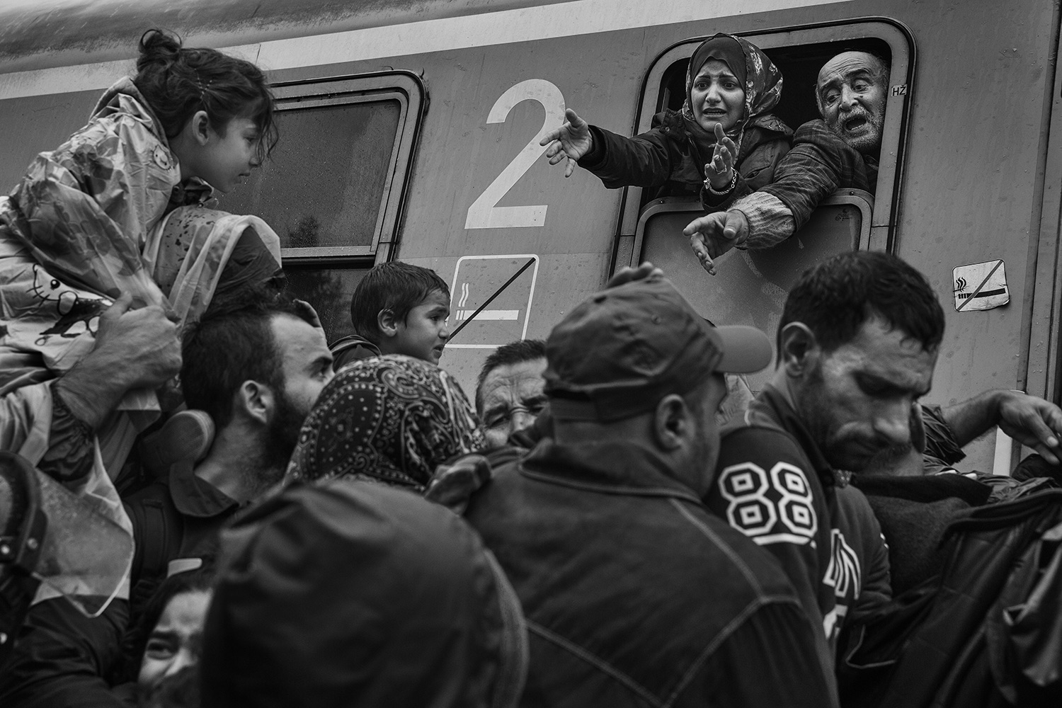Refugees mainly from Syria, but also Afghanistan, Iraq and parts of Africa making their way across Europe. Walking from Serbia across border to Croatia, where they gathered at Tovarnik to board trains and buses to be transported to either Hungary or Slovenia, then to be taken to border with Austria and onward. by James Nachtwey