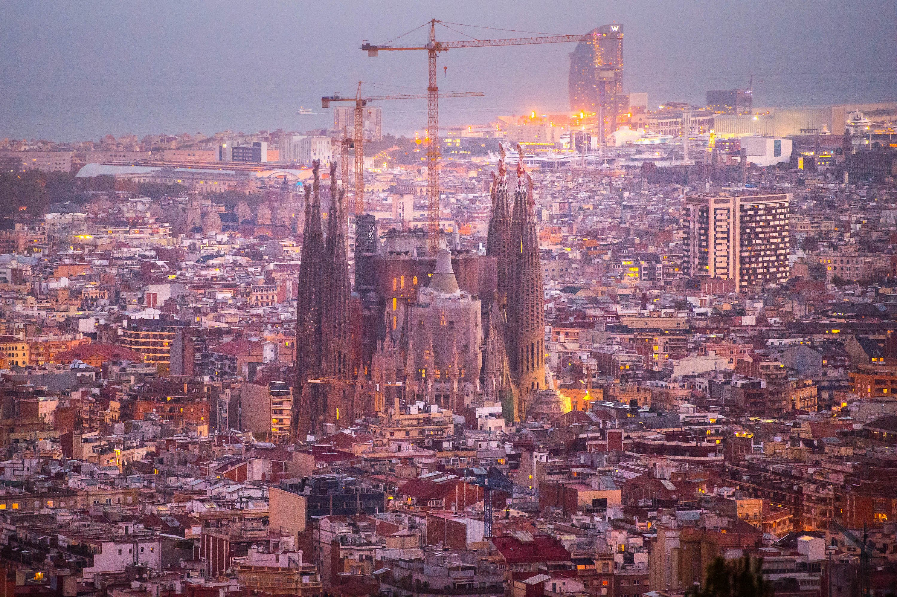 'La Sagrada Familia' stands over residential buildings in Barcelona on Oct. 26, 2015.