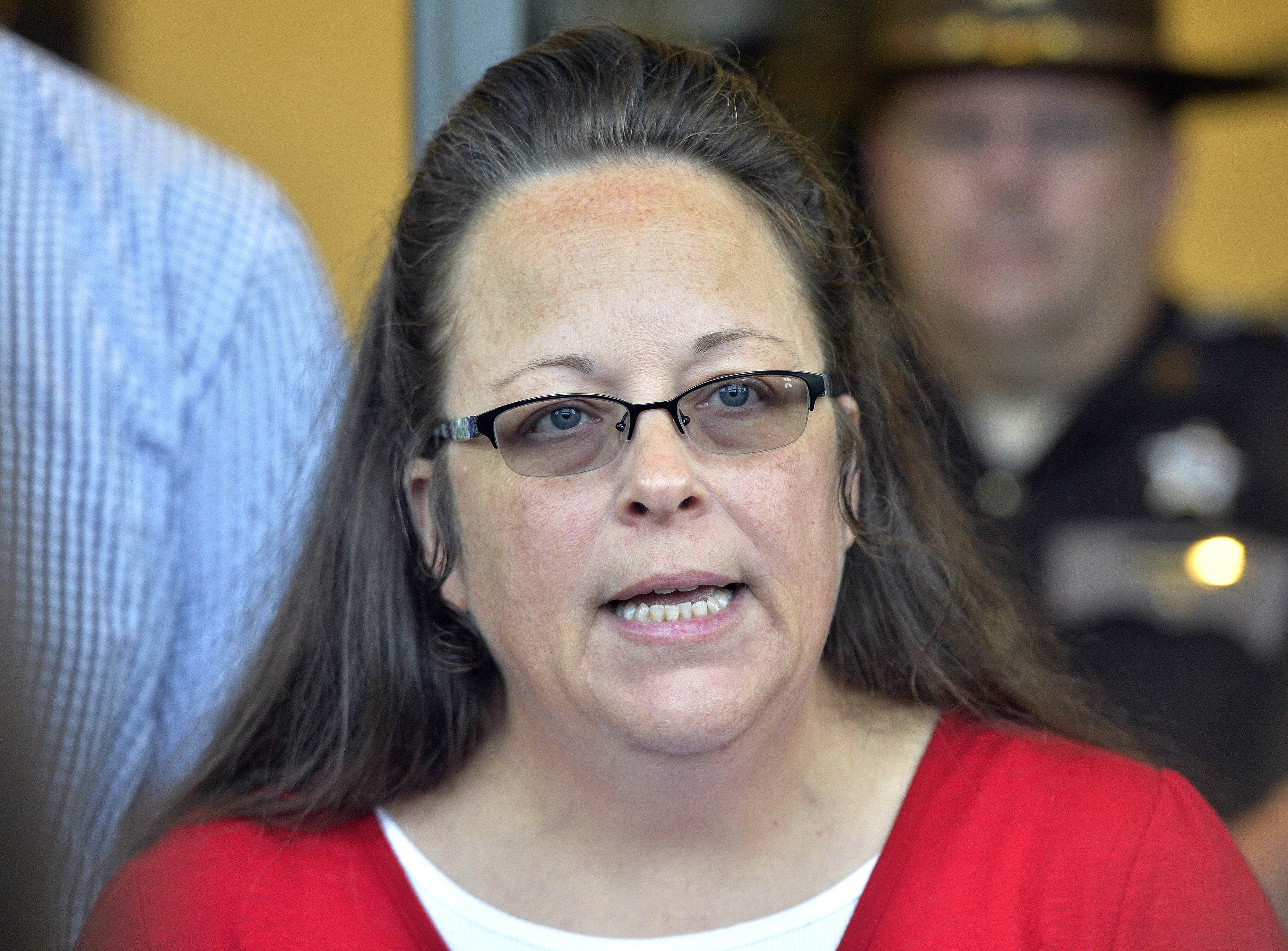 FILE - In this Sept. 14, 2015 file photo, Rowan County Clerk Kim Davis makes a statement to the media at the front door of the Rowan County Judicial Center in Morehead, Ky. On Friday, Oct. 2, 2015. (Timothy D. Easley—AP)