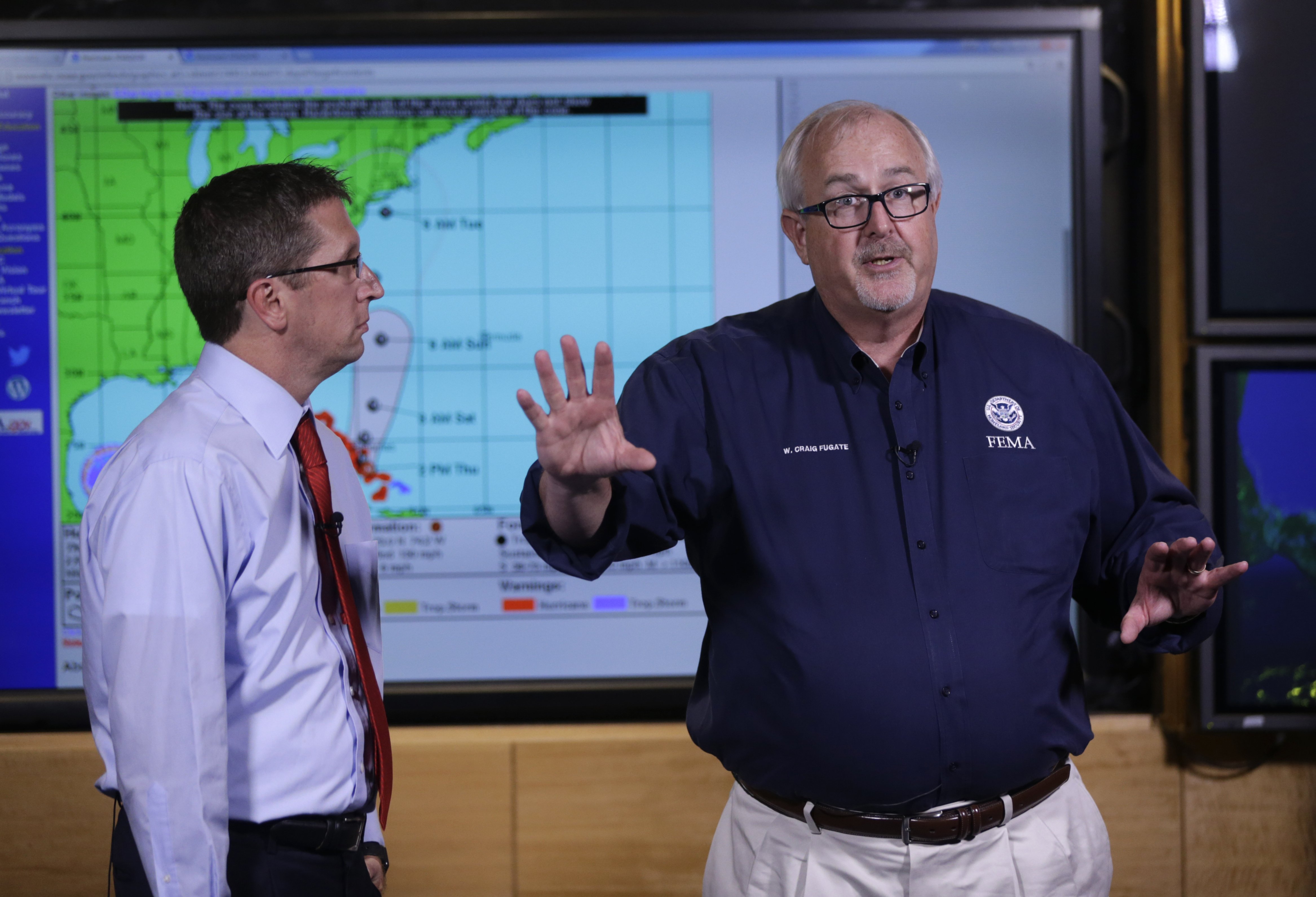Craig Fugate, Administrator of the Federal Emergency Management Agency (FEMA), right, talks about the status of Hurricane Joaquin as it moves through the eastern Bahamas as Rick Knabb, Director of the National Hurricane Center, left, looks on at the National Hurricane Center in Miami, on Oct. 1, 2015. (Lynne Sladky—AP)