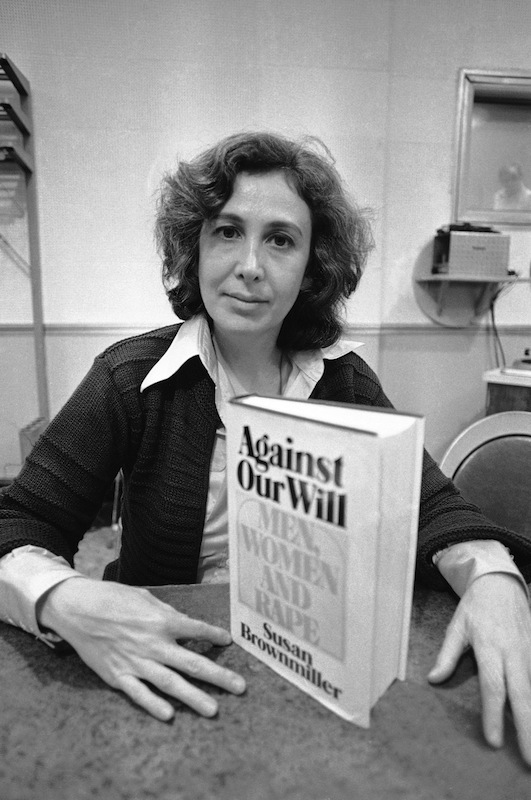 Susan Brownmiller, poses with her book “Against Our Will - Men, Women and Rape” in New York City on Oct. 18, 1975 (Suzanne Vlamis—AP)
