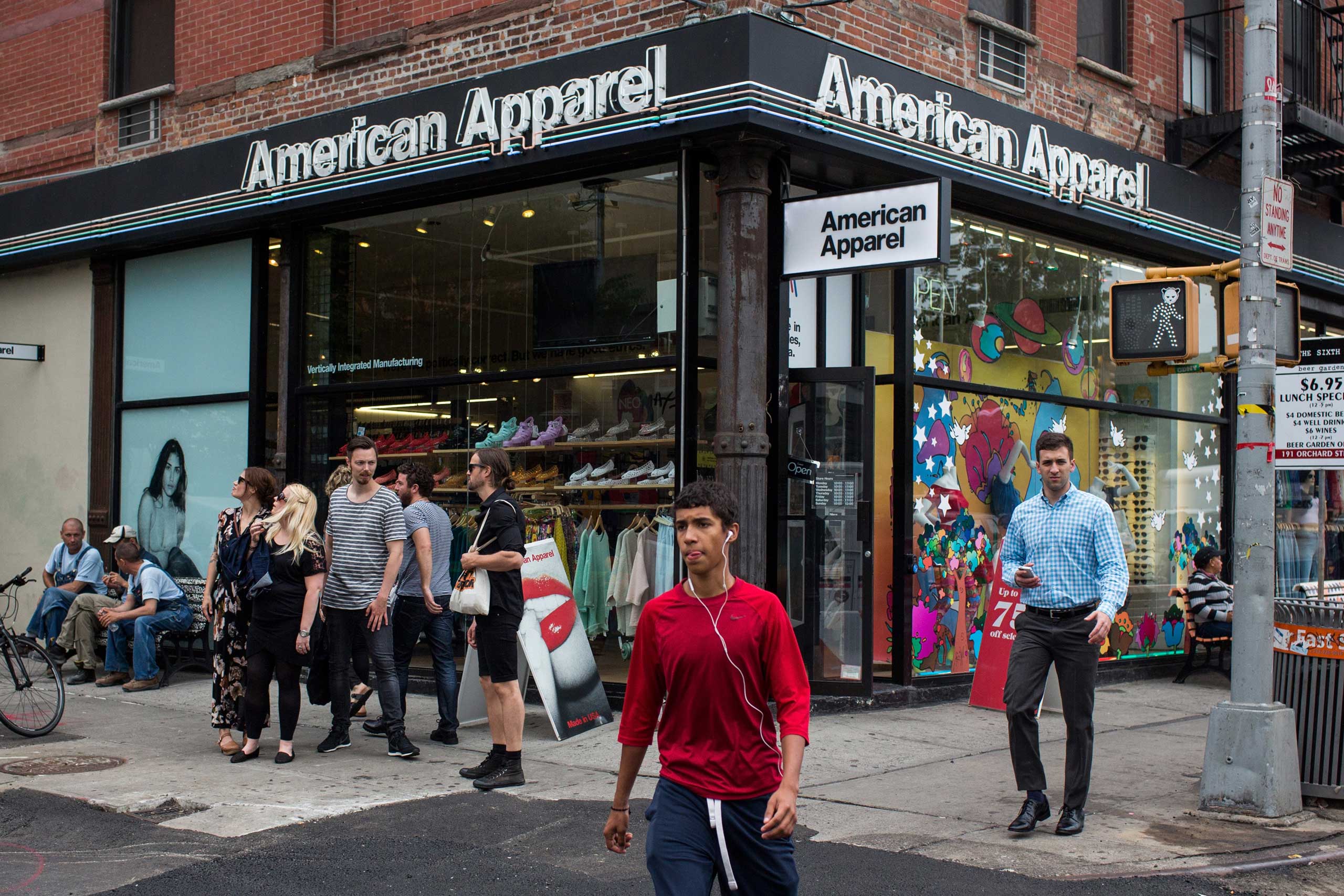 People walk past an American Apparel store in New York City. (Andrew Burton—Getty Images)