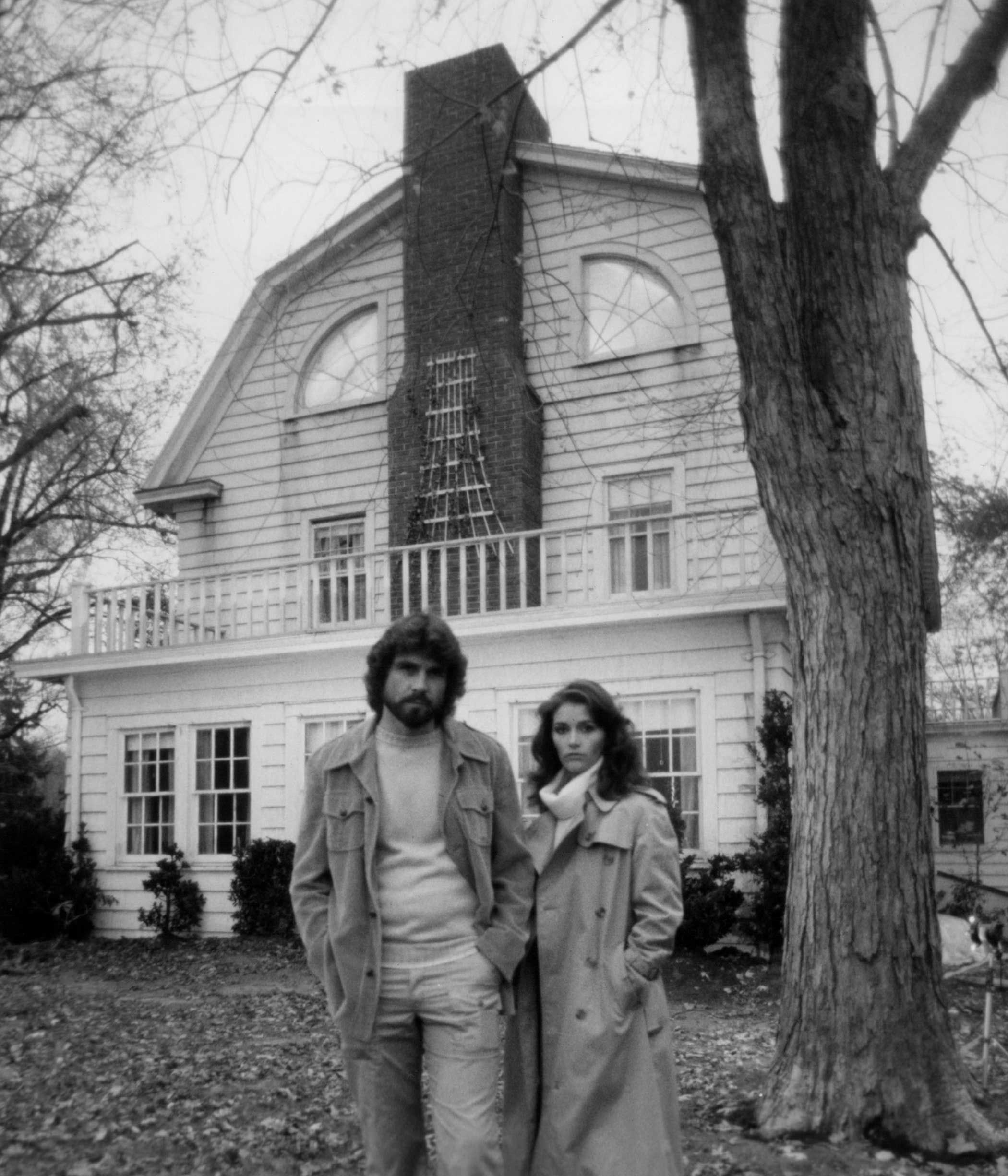 The Amityville Horror, 1979 The film is based on the alleged paranormal encounters that George and Kathy Lutz experienced after moving into their three-story colonial home in Amityville, N.Y. in 1975. The year before, the house had been the site of a terrible mass murder, when 23-year-old Ronnie DeFeo killed both his parents and four siblings.