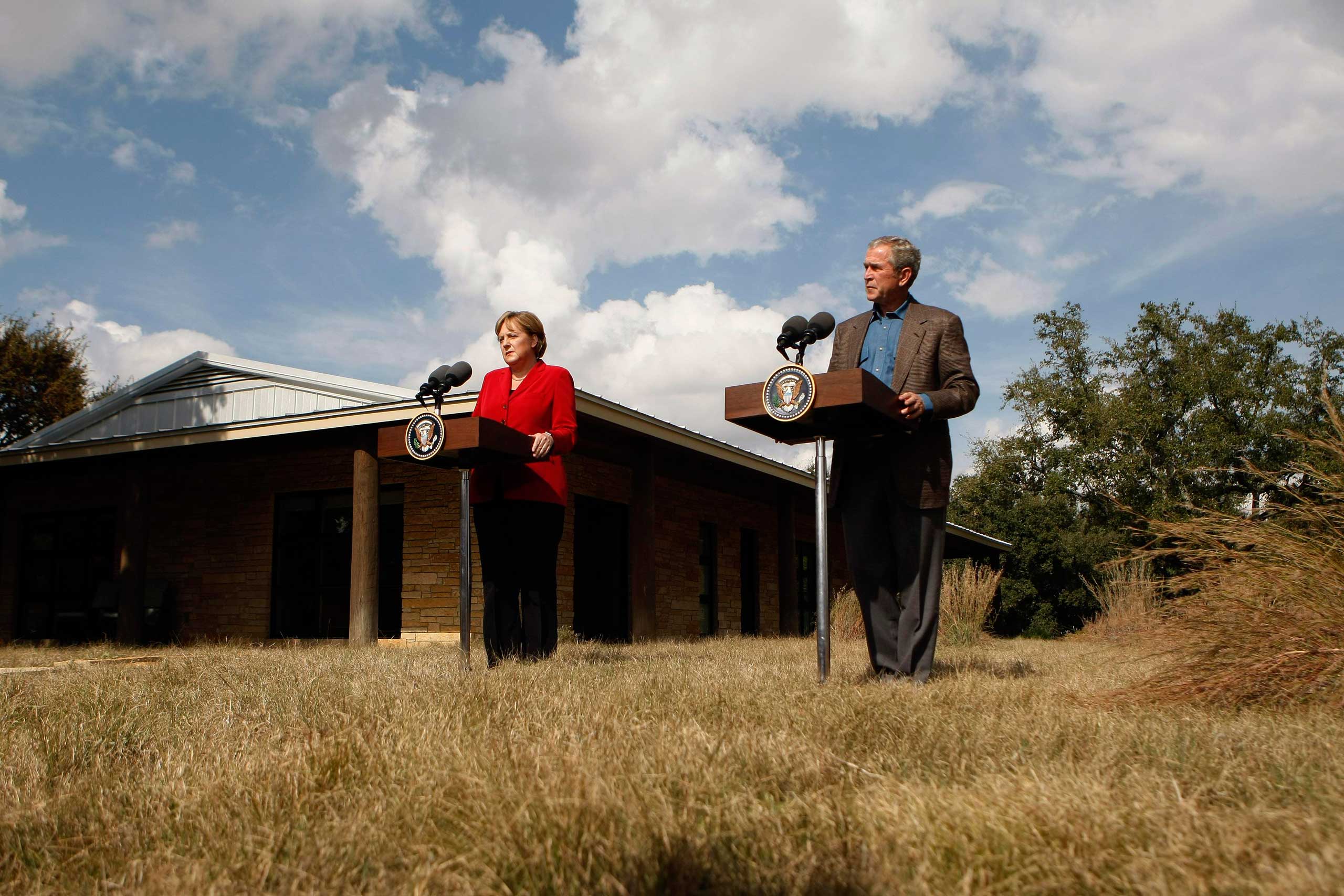 President George W. Bush and Chancellor Angela Merkel talk to the media at the Bush ranch in Crawford, Texas, in 2007.