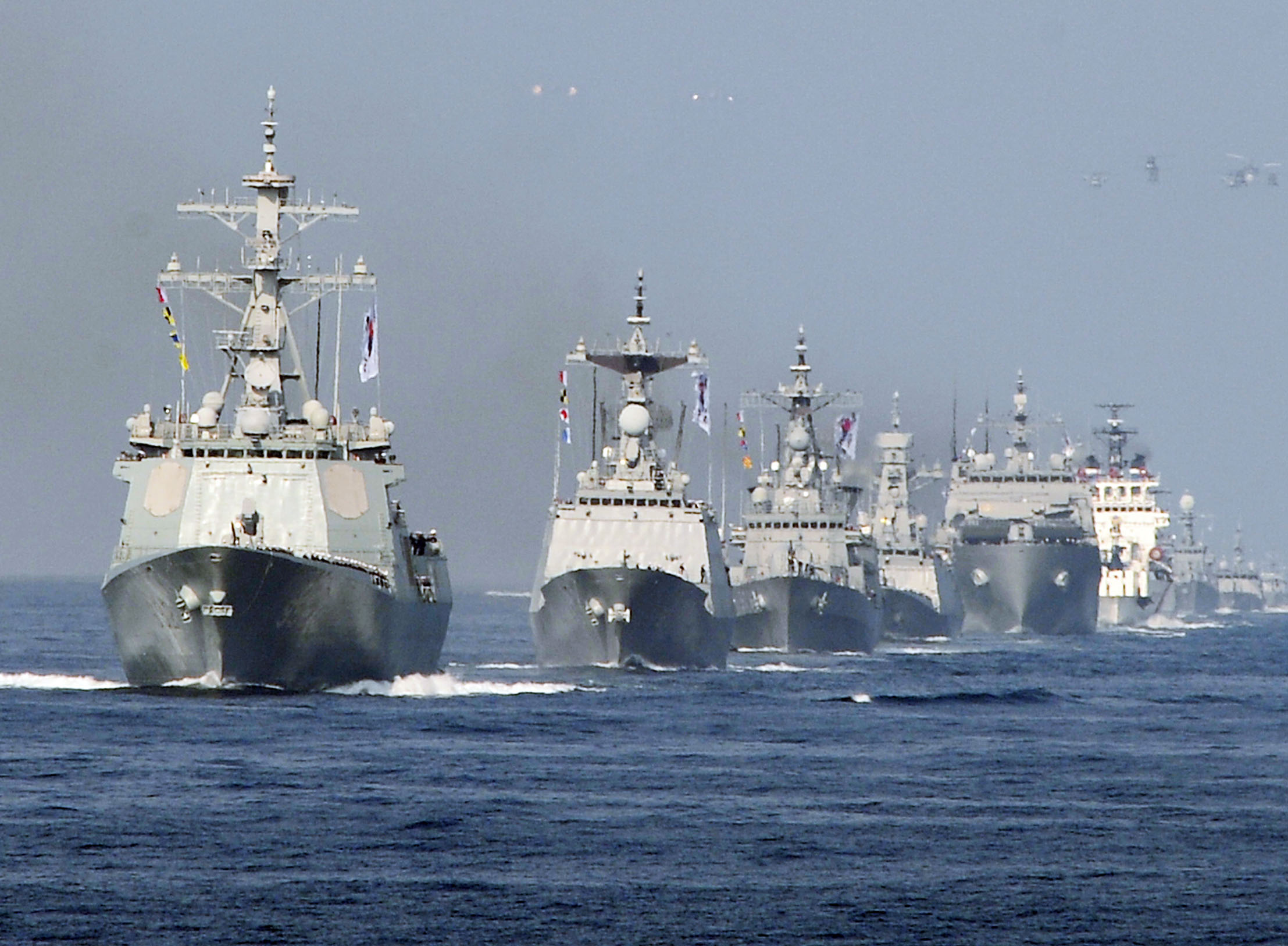 South Korean military vessels navigate on waters off Busan, South Korea, on Oct. 23, 2015, during a fleet review to celebrate the 70th founding anniversary of the country's navy (Kyodo—AP)