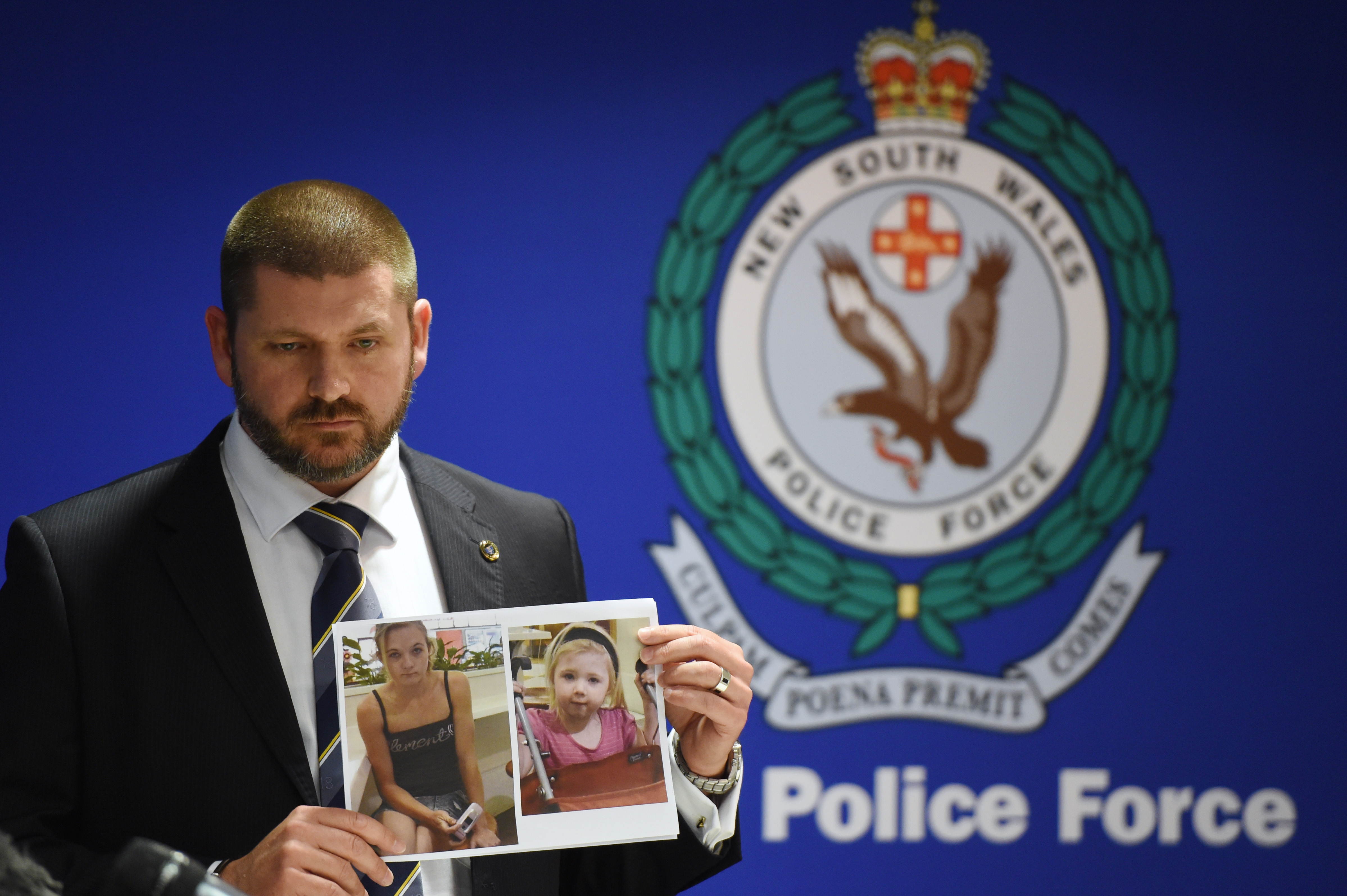 Police Detective Inspector Jason Dickinson holds up a photo of Karlie Jade Pearce-Stevenson and her daughter Khandalyce Kiara Pearce, during a press conference in Sydney, Wednesday, Oct. 21, 2015 (Dean Lewins—AP)