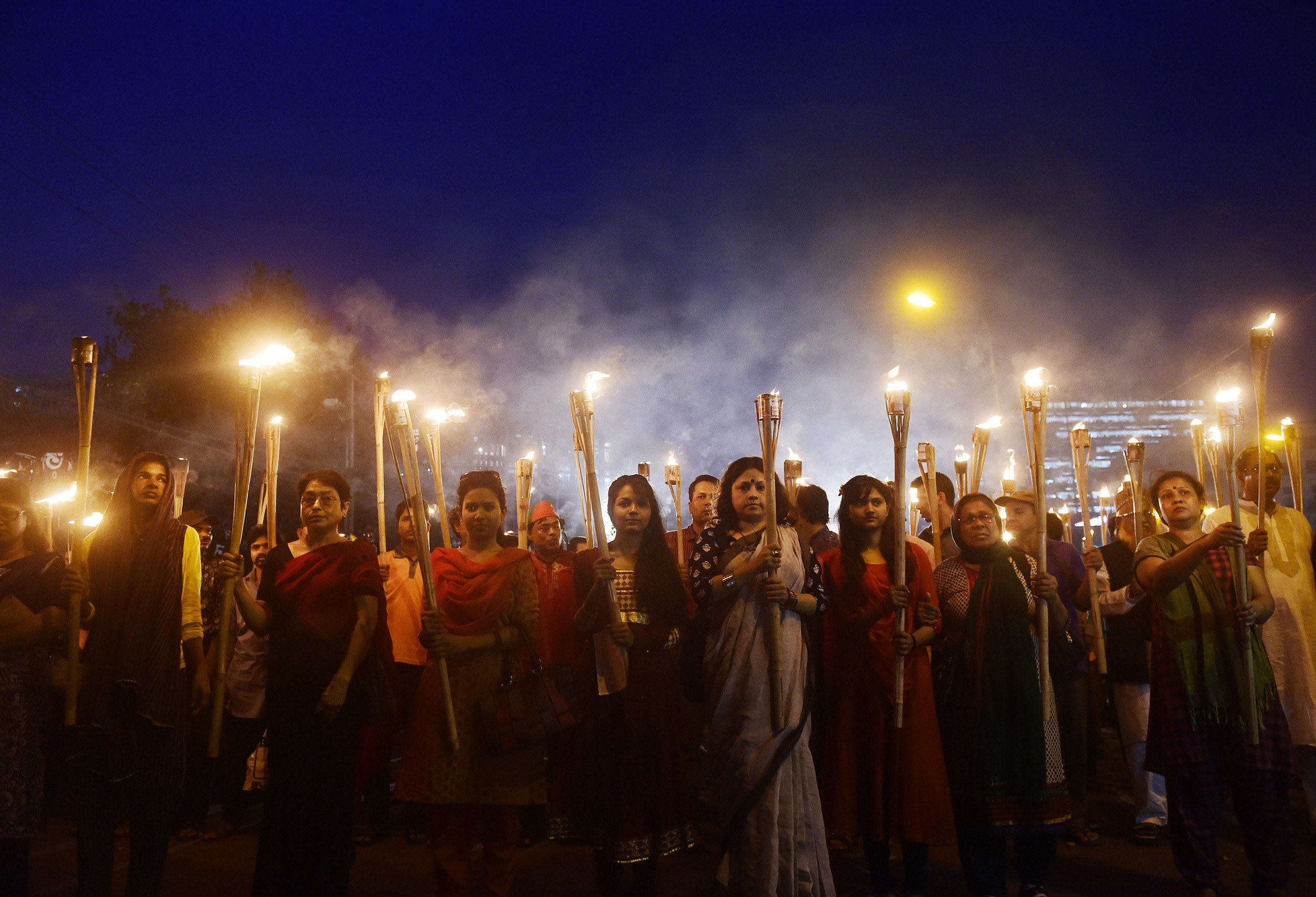 Bangladeshi activists take part in a protest in Dhaka on Feb. 27 over the murder of the secular blogger Avijit Roy. (Munir Uz Zaman—AFP/Getty Images)