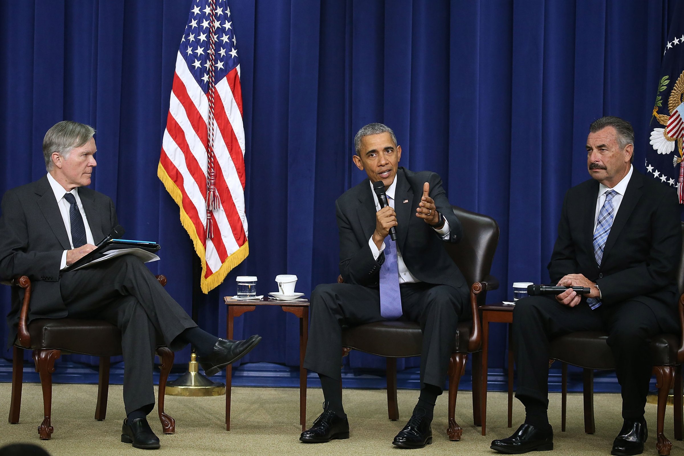 WASHINGTON, DC - OCTOBER 22: U.S. President Barack Obama participates in a conversation on criminal justice reform while flanked by Bill Keller (L) of The Marshall Project, and Charlie Beck (R) of the Los Angleles Police, at the White House October 22, 2015 in Washington, DC. Later this month the√äSenate Judiciary Committee plans to vote on the Smarter Sentencing Act, which hopes to reform mandatory-minimum sentencing and the federal prison system. (Photo by Mark Wilson/Getty Images)