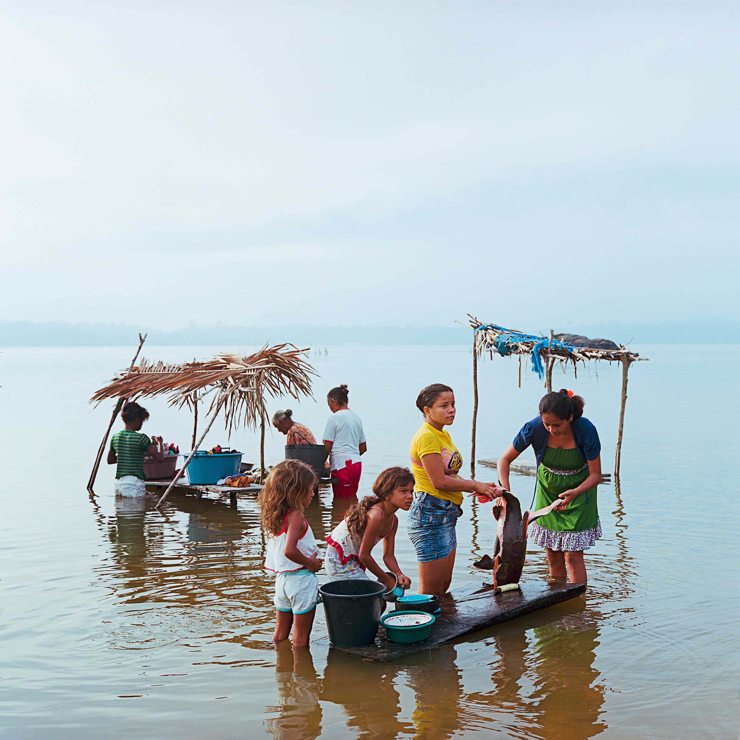 A Ribinerio family from the traditional riparian village of Mangabal on the Tapajos River. The village is threatened by a proposed major hydroelectric complex that would flood their land forcing them to move to the nearby city of Itaituba, Dec. 2014.