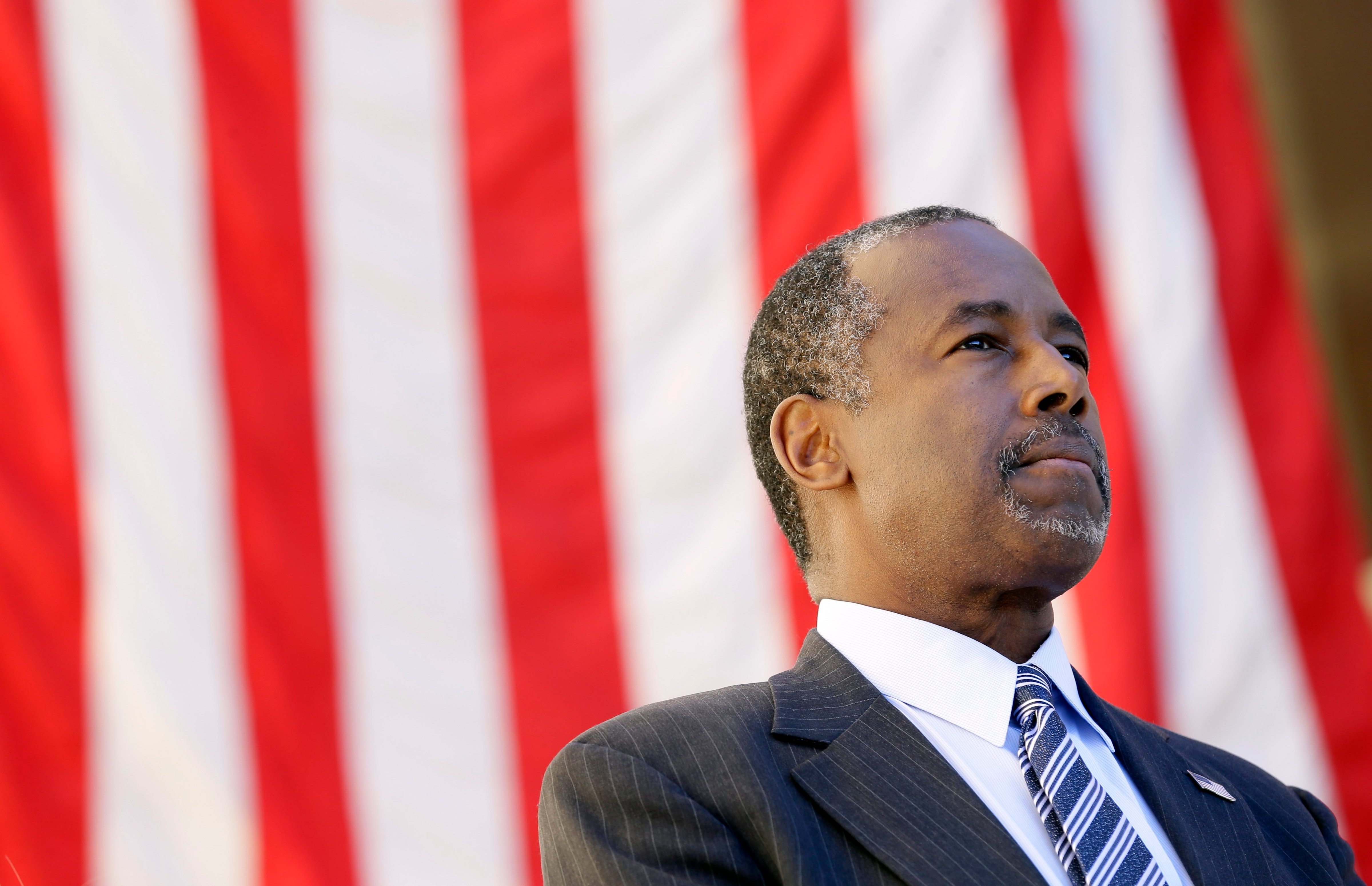 Ben Carson looks on as he is introduced to speak at a town hall meeting, on Oct. 2, 2015, in Ankeny, IA. (Charlie Neibergall—AP)