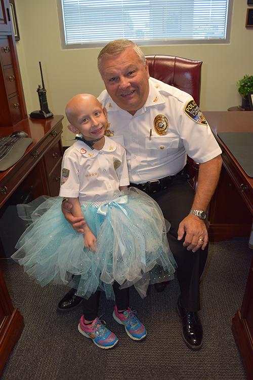 Sydney Coari poses with St. Charles County Police Chief David Todd (Courtesy of St. Charles County Police Department)