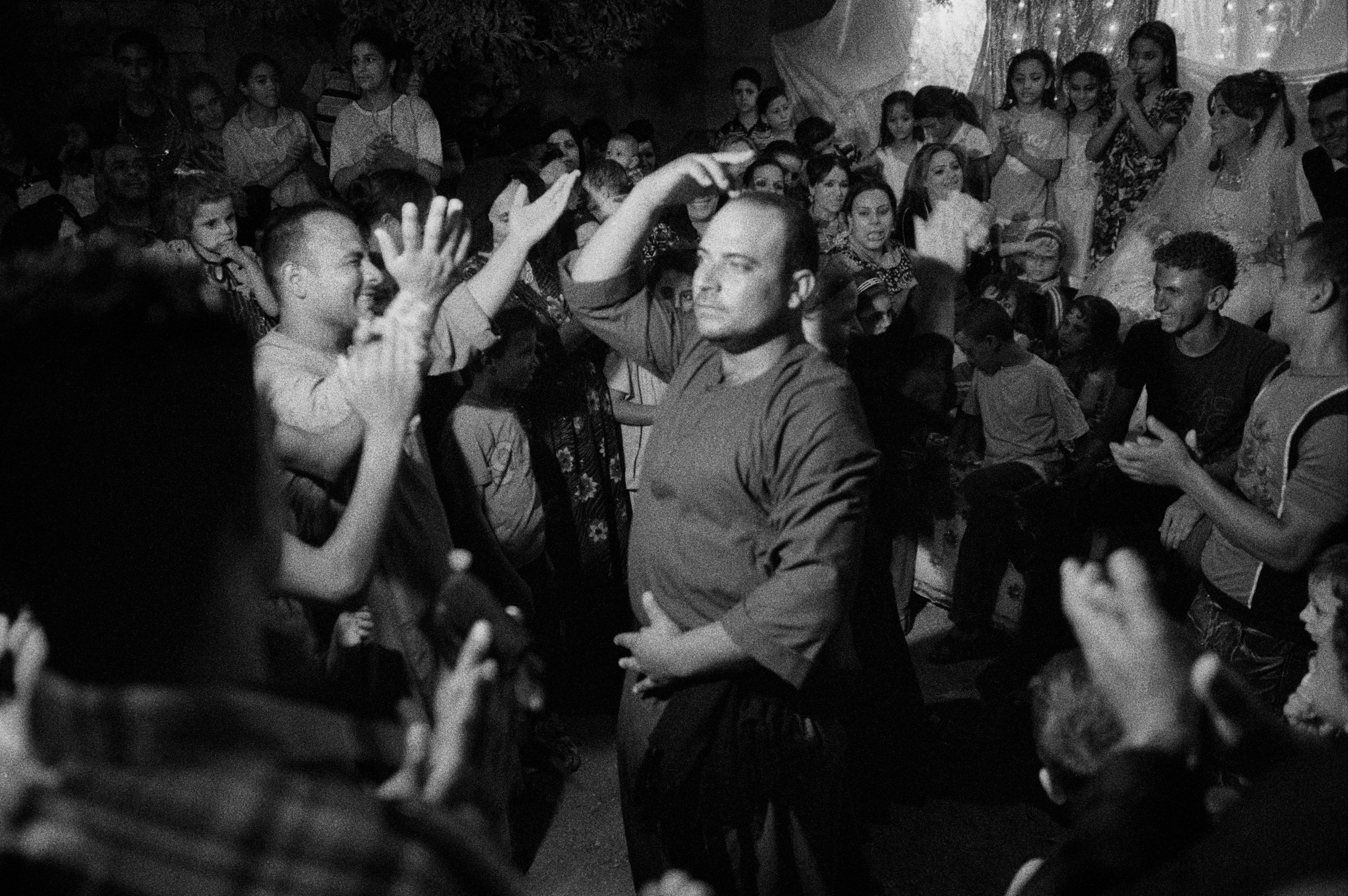 Deir Abu Hennis, Egypt. Dancing in front of the bride's house. August 2011.