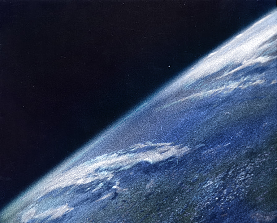 A colorized version of the first photo of the Earth taken from space