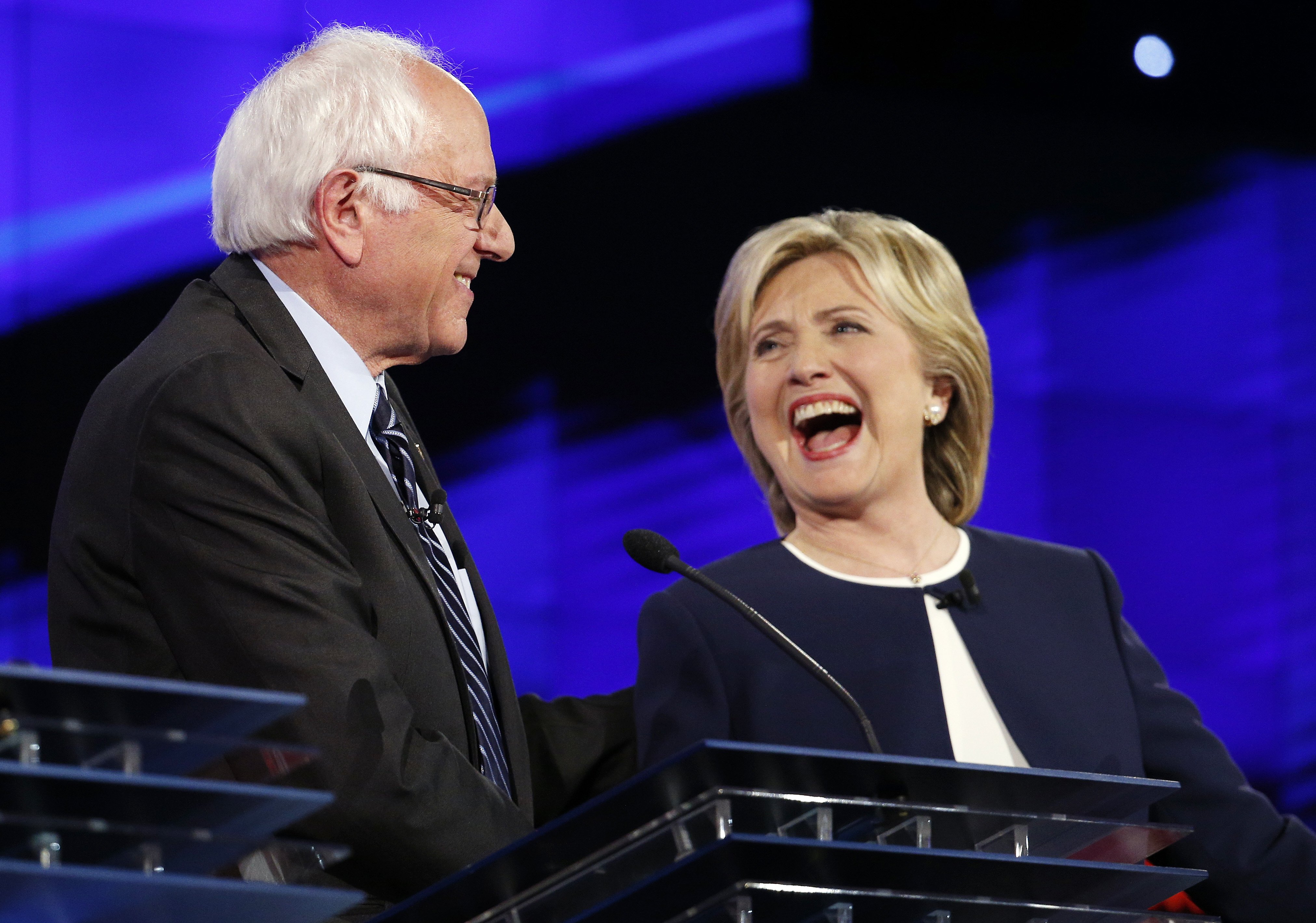 Sen. Bernie Sanders, of Vermont,, left, and Hillary Rodham Clinton laugh during the CNN Democratic presidential debate, on Oct. 13, 2015, in Las Vegas. (John Locher—AP)