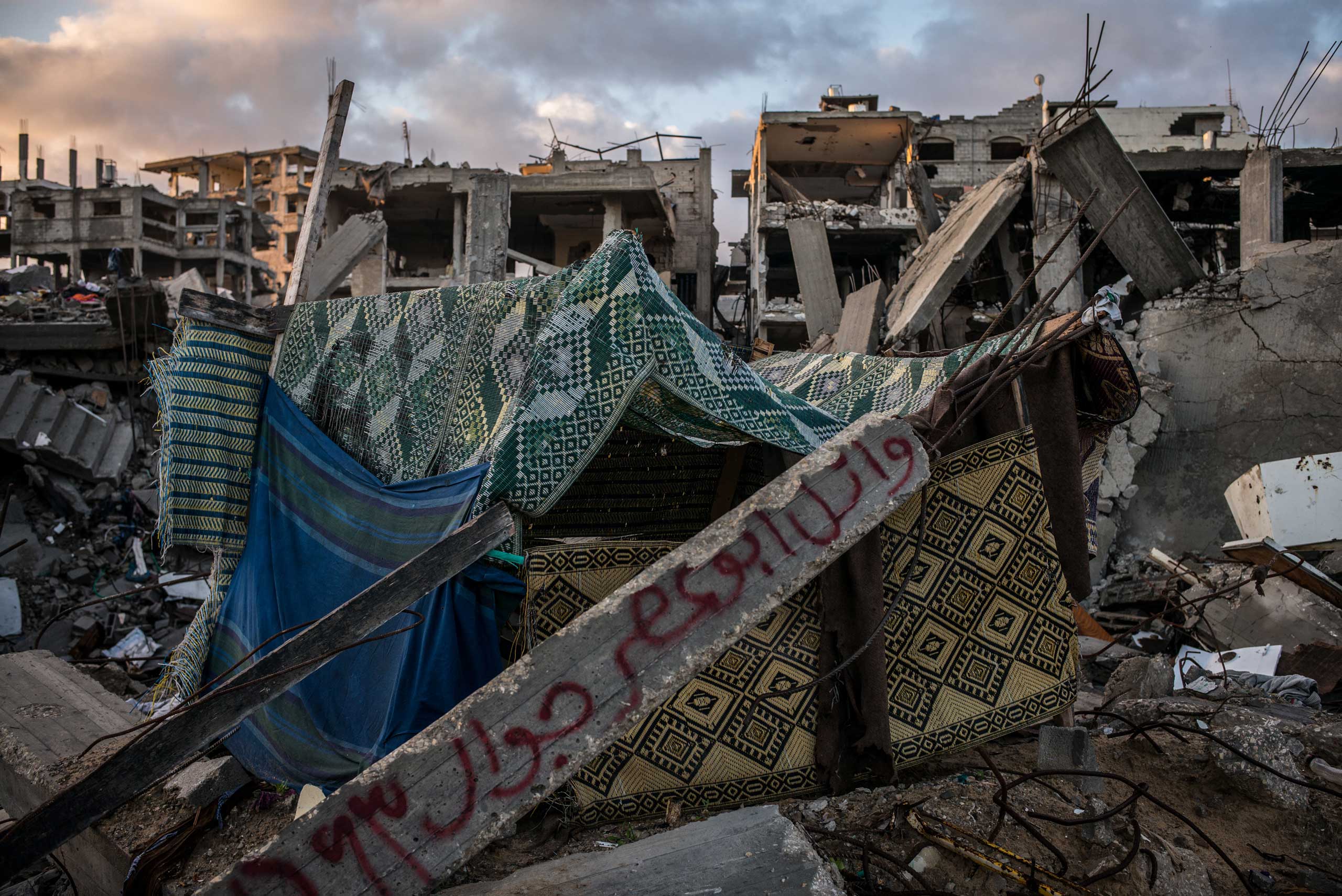 A destroyed building in Shejaiya, Gaza. Families have written their names on the rumbles that once were their homes. The Gaza Strip. December 2014.