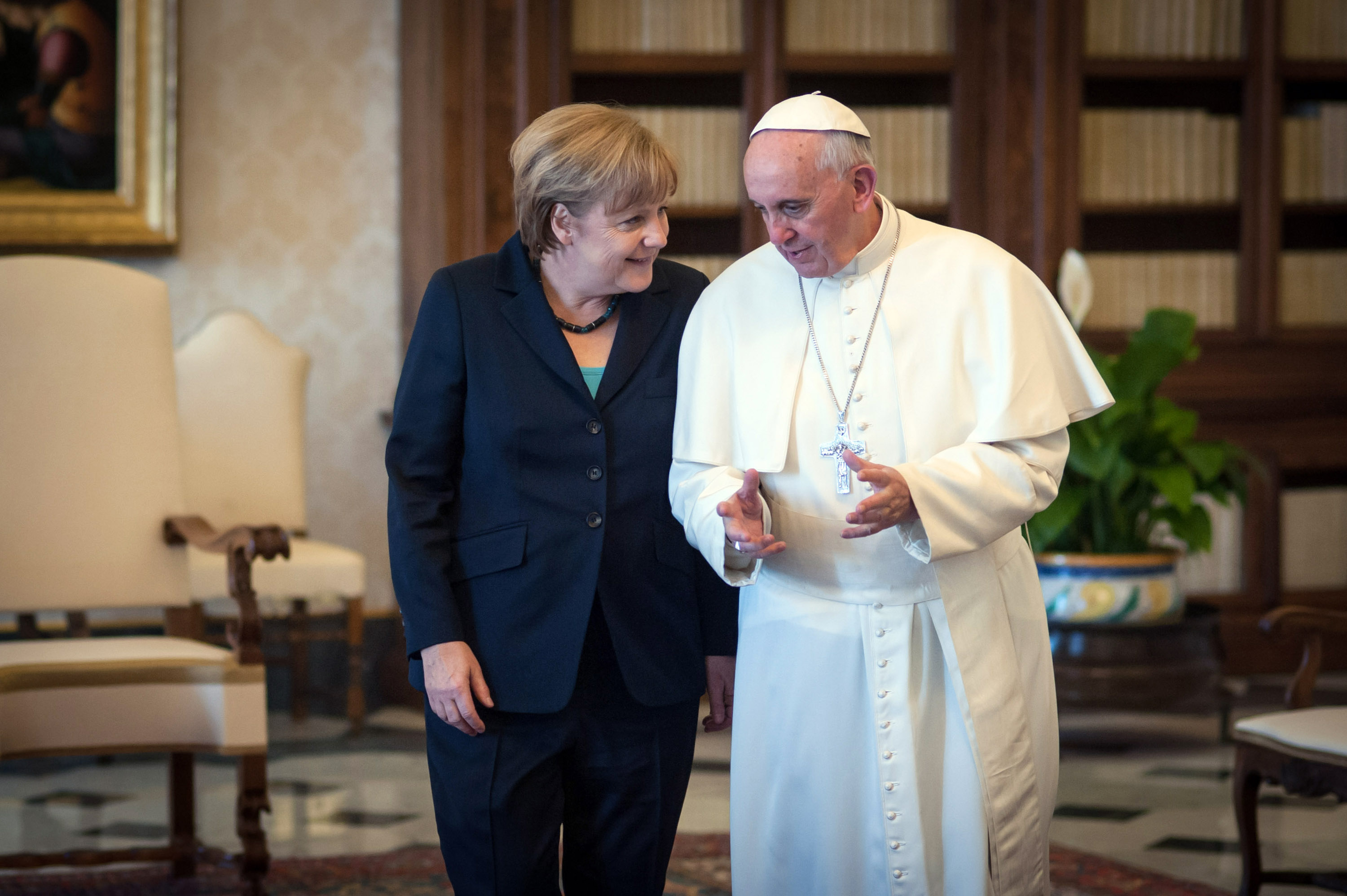 Angela Merkel chats with Pope Francis after their meeting in his private library at the Vatican, in 2013.
