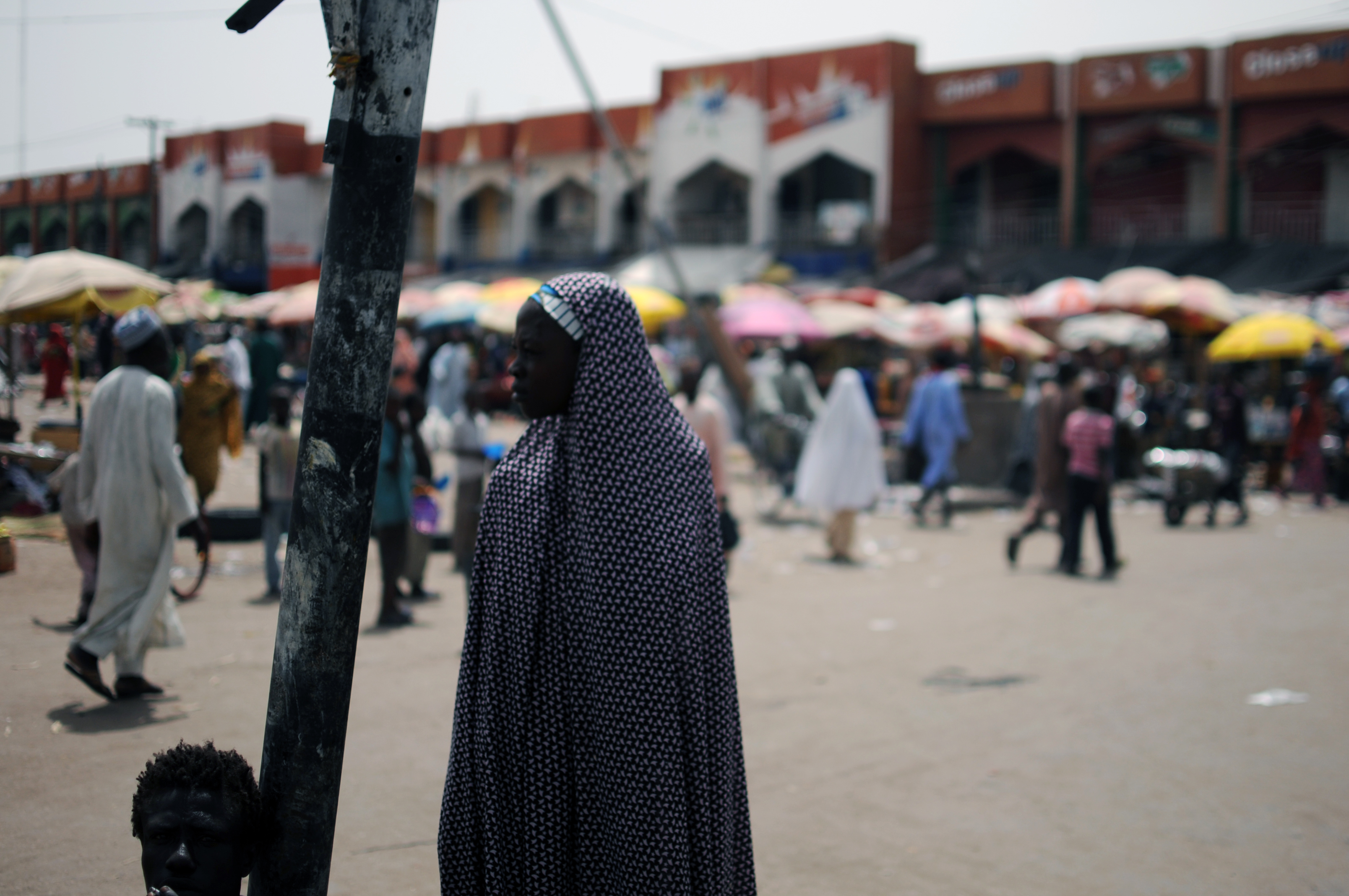 A woman stands at the market  in Maiduguri, the capital of Borno state, Nigeria, on June 6, 2013 (Quentin Leboucher—AFP/Getty Images)