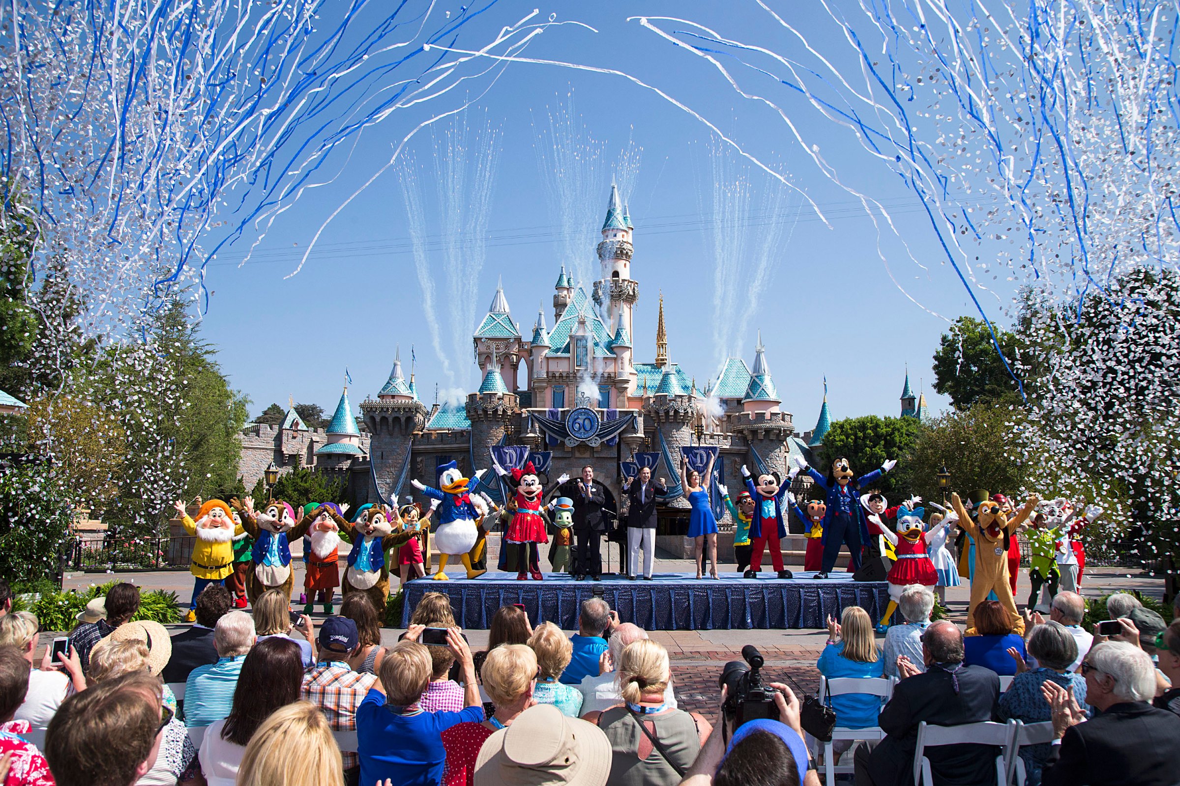(July 17, 2015) Ð Mickey Mouse and his friends celebrate the 60th anniversary of Disneyland park during a ceremony at Sleeping Beauty Castle featuring Academy Award-winning composer, Richard Sherman and Broadway actress and singer Ashley Brown, in Anaheim, Calif. on Friday, July 17. Celebrating six decades of magic, the Disneyland Resort Diamond Celebration features three new nighttime spectaculars that immerse guests in the worlds of Disney stories like never before with "Paint the Night," the first all-LED parade at the resort; "Disneyland Forever," a reinvention of classic fireworks that adds projections to pyrotechnics to transform the park experience; and a moving new version of "World of Color" that celebrates Walt DisneyÕs dream for Disneyland. (Paul Hiffmeyer/Disneyland Resort)