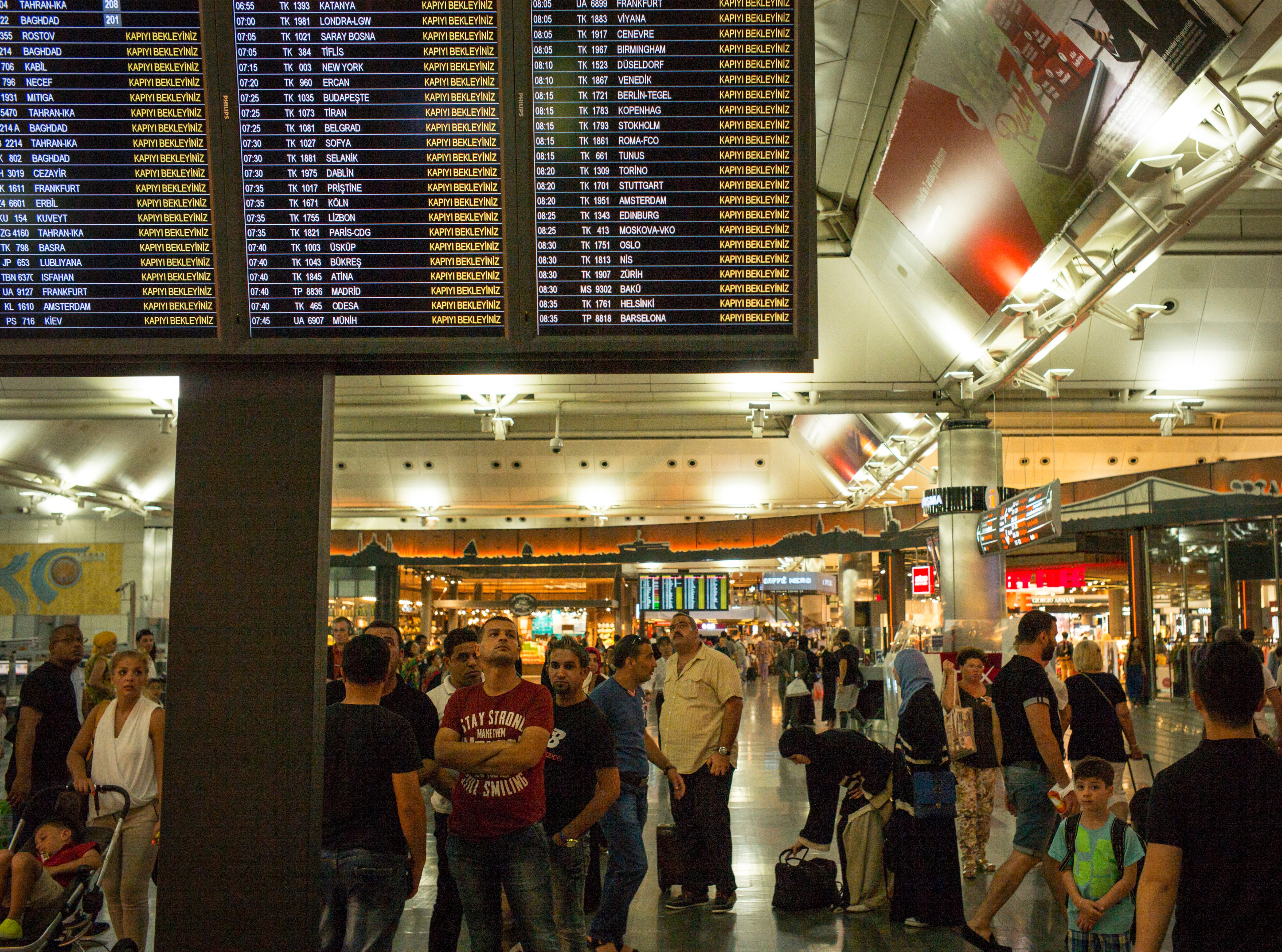 Travelers check an electronic flight board for their time of departure and gate August 29, 2015 at the Istanbul Ataturk Airport in Istanbul, Turkey. (Robert Nickelsberg&mdash;Getty Images)