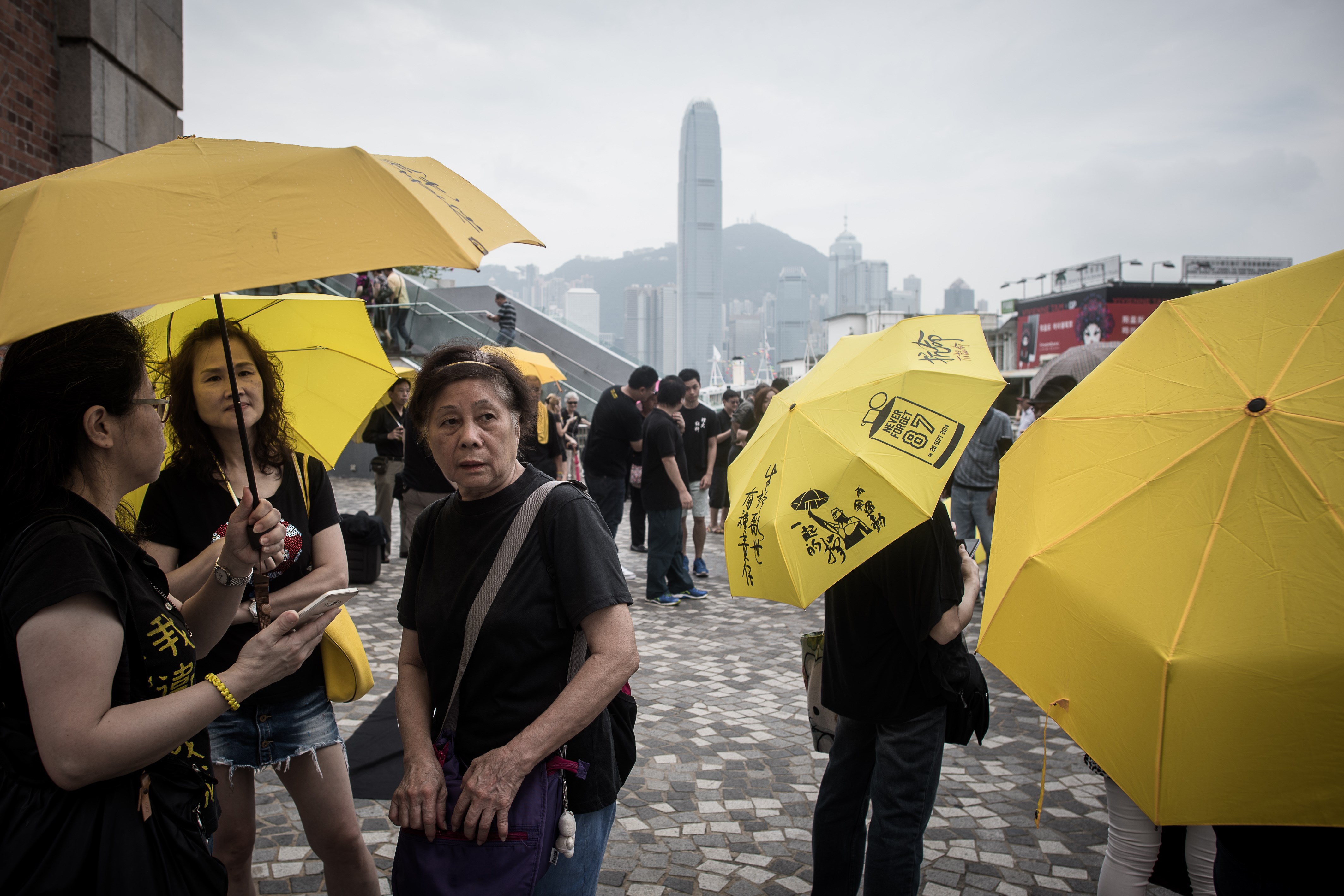 Pro-democracy demonstrators hold yellow umbrellas, a symbol of the pro-democracy movement in Hong Kong on Oct. 1, 2015, as they gather on China's National Day to denounce Beijing's influence over the territory (Philippe Lopez—AFP/Getty Images)