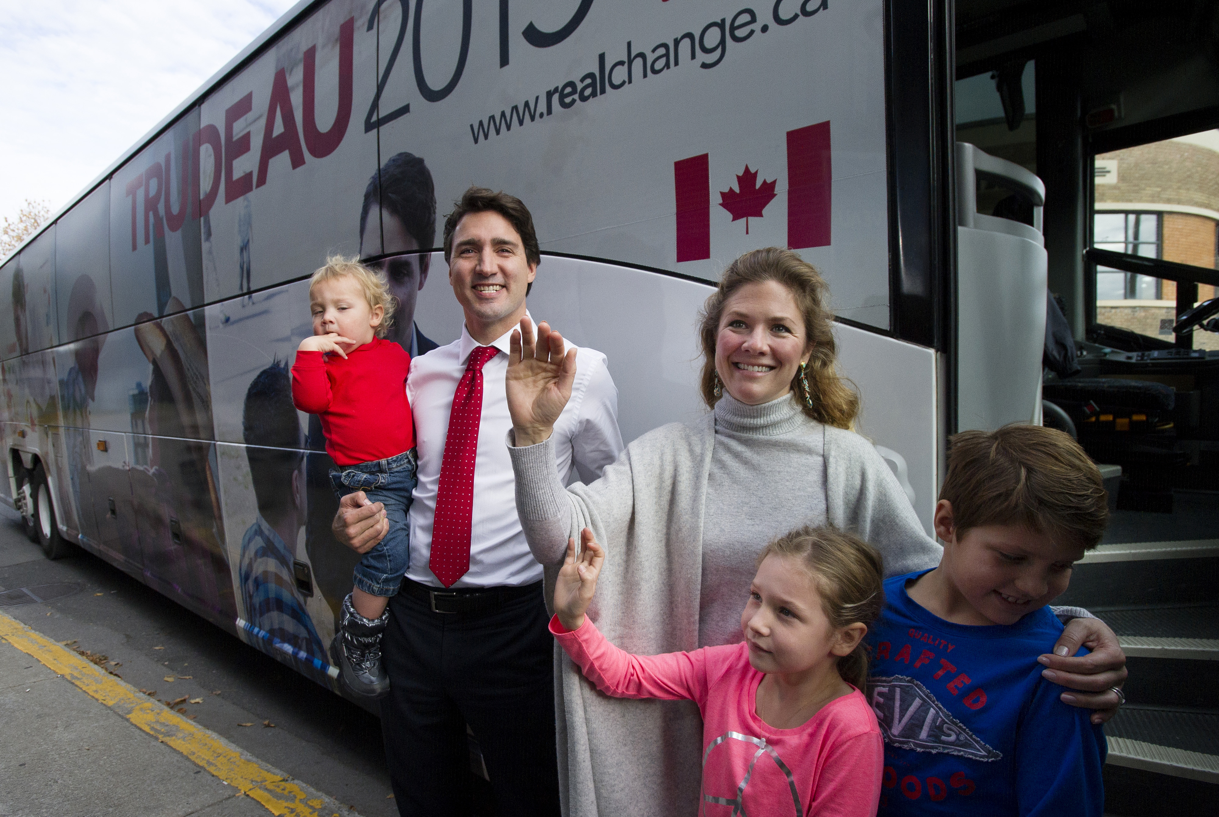 Justin Trudeau and Sophie Gregoire-Trudeau wave with their children on election day in Montreal, on Oct. 19, 2015.