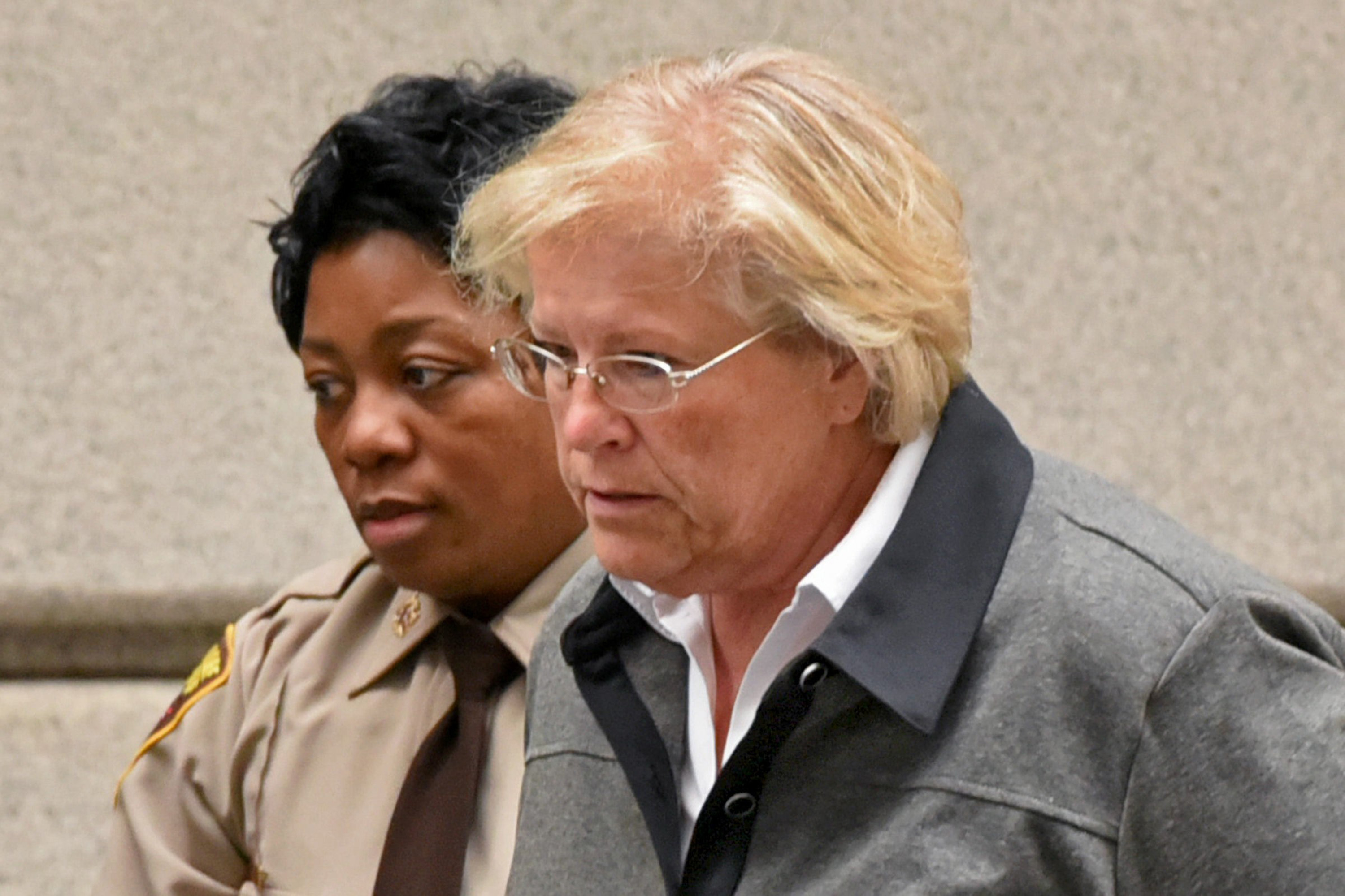 Former Episcopal Bishop Heather Cook, who pleaded guilty last month in the drunk-driving hit and run death of cyclist Thomas Palermo, is led from the courtroom after receiving a seven-year sentence on Tuesday, Oct. 27, 2015. (Baltimore Sun—TNS via Getty Images)