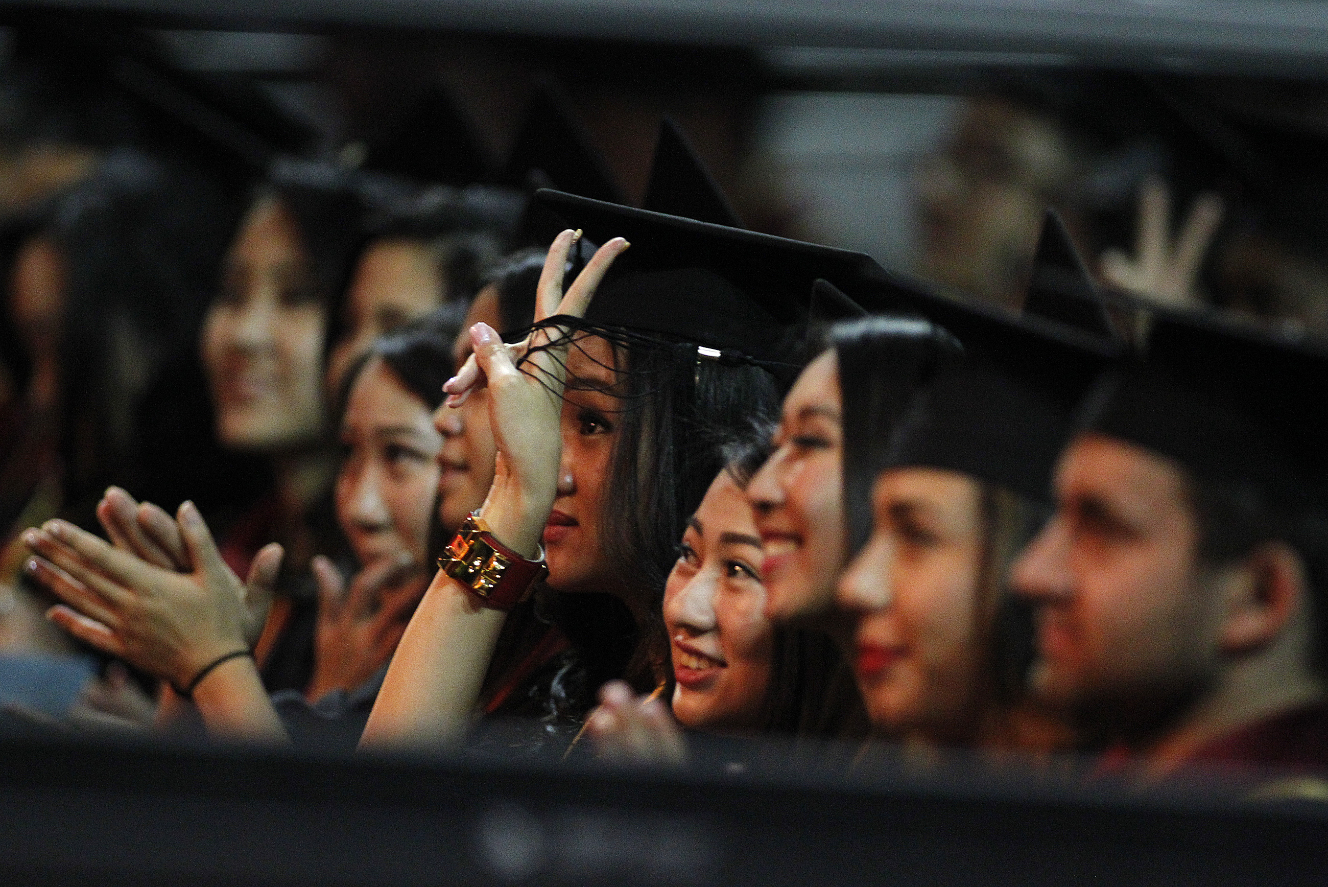 LOS ANGELES, CA.-MAY 16, 2014:  USC Marshall School of Business graduates cheer after listening to t