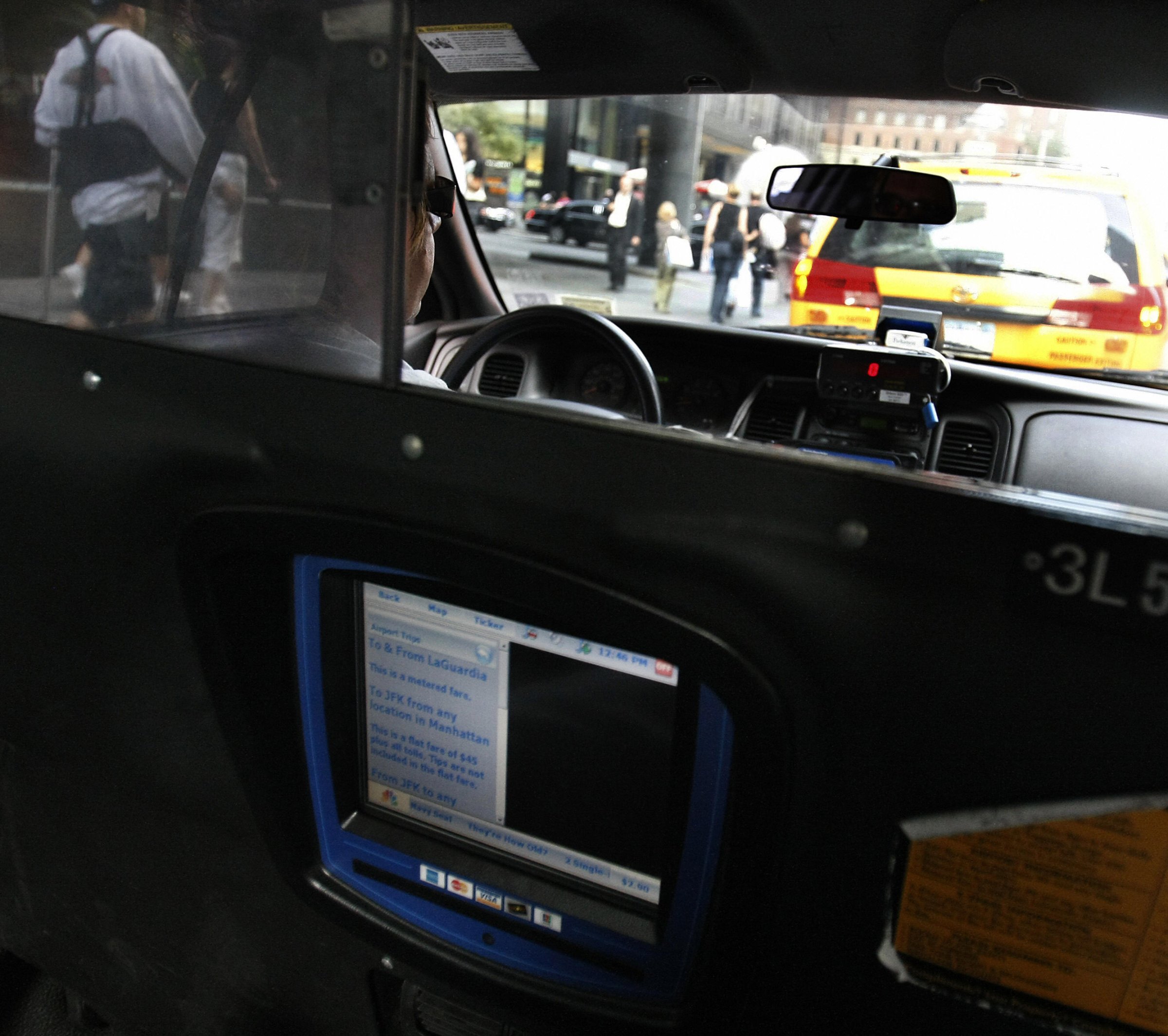 A New York City cab driver waits in line