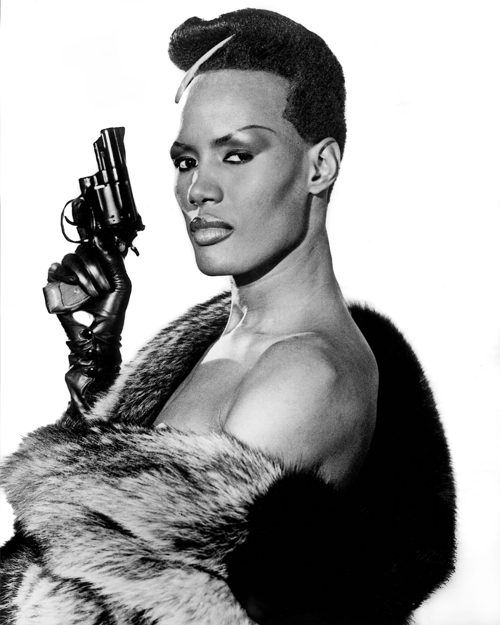 May Day (Grace Jones)
                              A View to a Kill, 1985
                              The film had some serious sexism issues, but it's redeemed by Grace Jones' performance. Chief of an all-female group of body guards, villain-turned-hero May Fay has super human strength. At one point she easily lifts a man over her head.