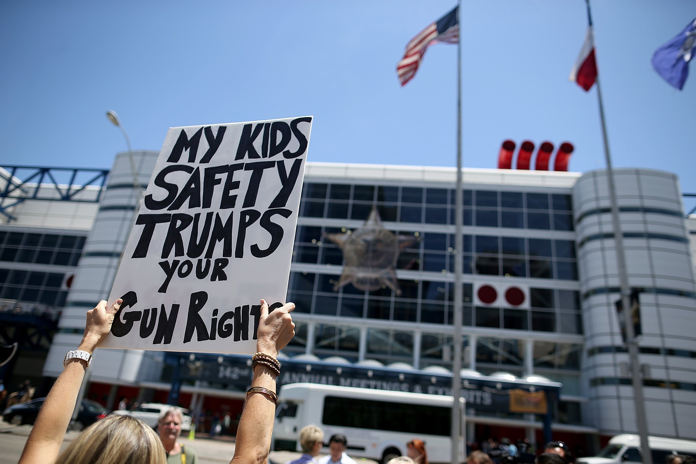 A protestor holds a sign during a demonstration in favor of gun regulation in Houston on May 4, 2013.