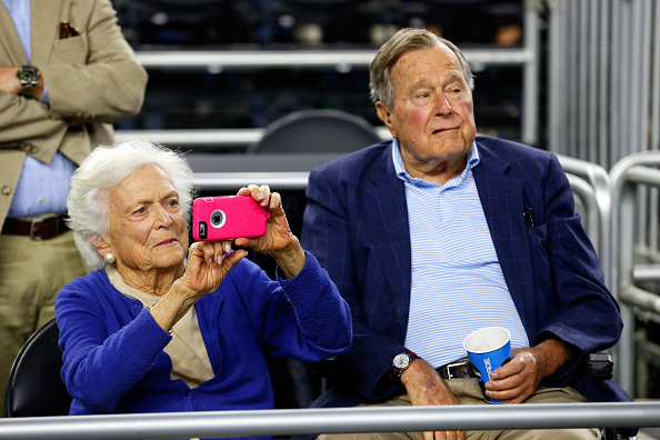 Former First Lady Barbara Bush and former President George H.W. Bush look on prior to the South Regional Final of the 2015 NCAA Men's Basketball Tournament between the Duke Blue Devils and the Gonzaga Bulldogs at NRG Stadium on March 29, 2015 in Houston, Texas.