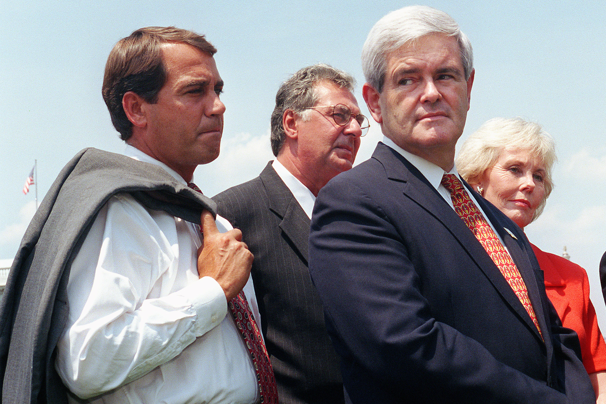 John Boehner stands with then-House Speaker Newt Gingrich at a news conference in 1997.