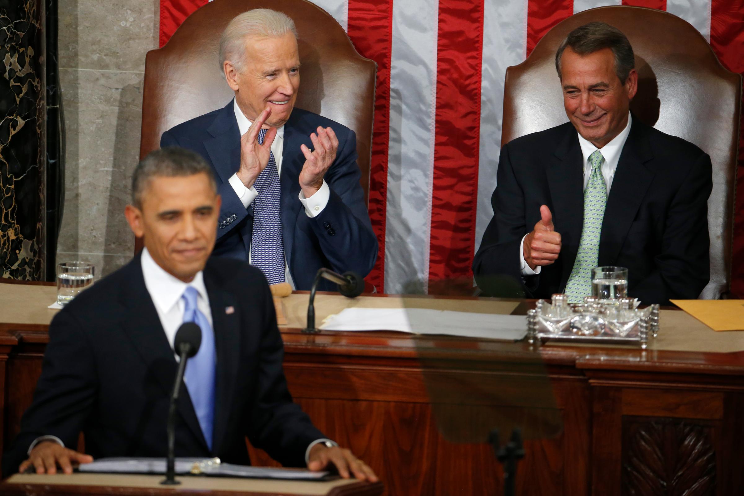 House Speaker John Boehner gestures toward President Barack Obama as Vice President Joe Biden applauds during the president's State of the Union address on Capitol Hill in Washington on Jan. 28, 2014.