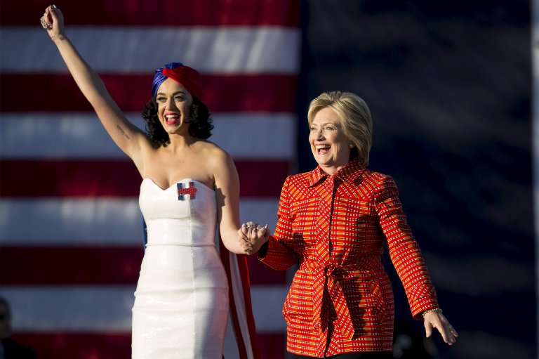 Democratic presidential candidate Hillary Clinton arrives with singer Katy Perry during a campaign rally in Des Moines, Iowa on Oct. 24, 2015. (Scott Morgan—Reuters)