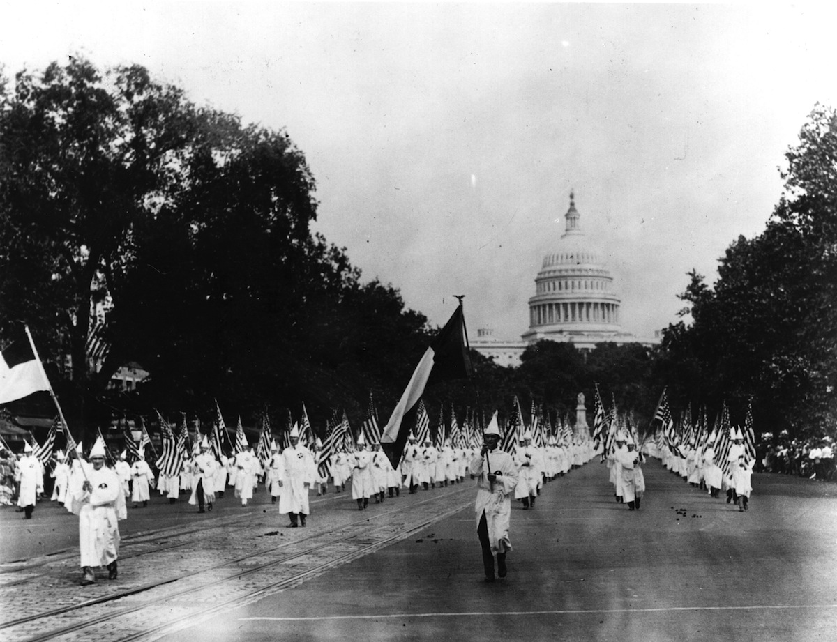 Members of the American white supremacist movement, the Ku Klux Klan marching down Pennsylvania Avenue in Washington DC on Aug. 19, 1925 (Topical Press Agency / Getty Images)