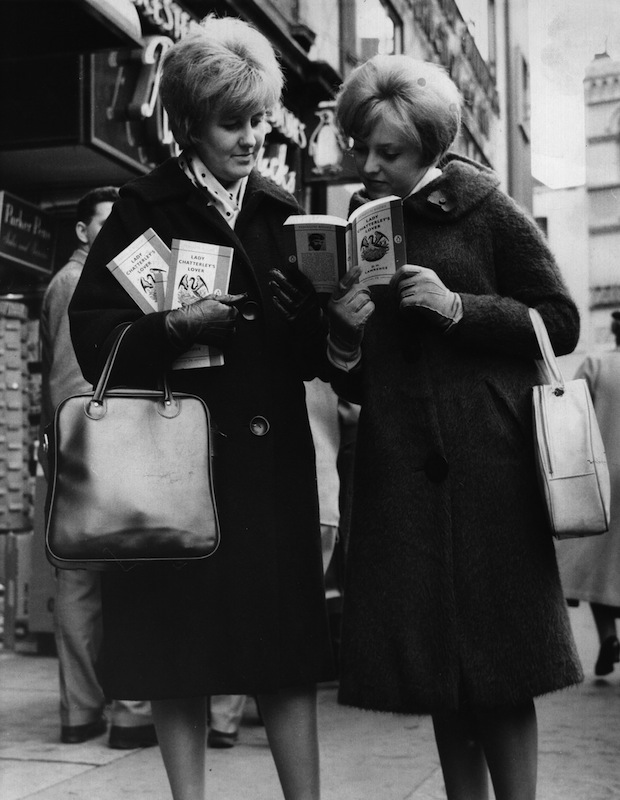 November 1960:  Two women outside a book shop in London, with paperback copies of 'Lady Chatterley's Lover' by D H Lawrence, after a jury at the Old Bailey decided that it was not obscene. (Keystone / Getty Images)