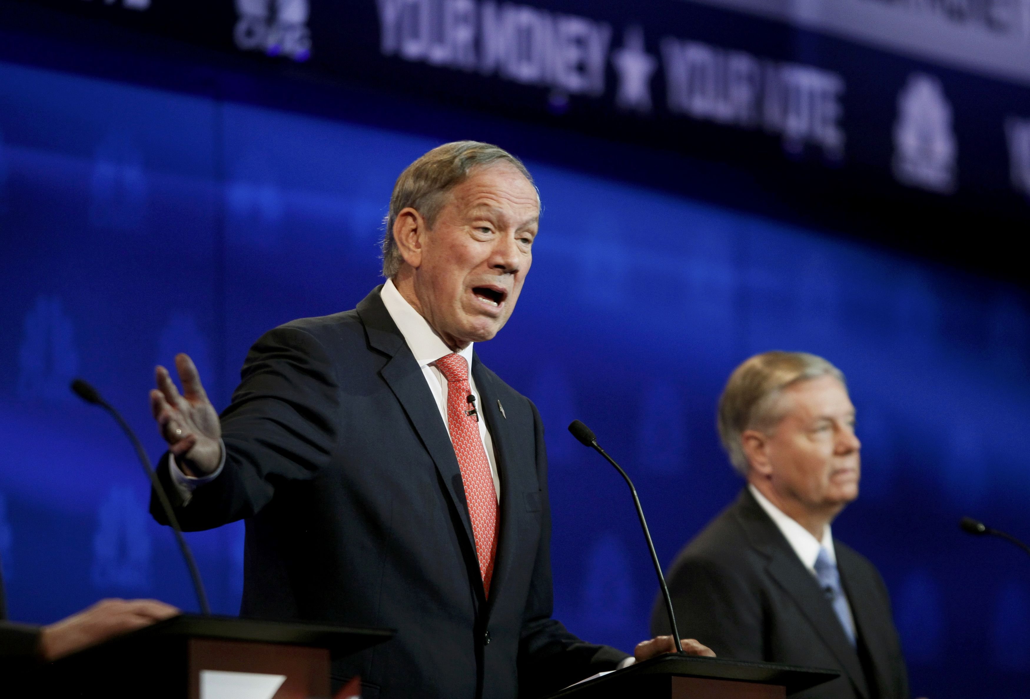 Republican U.S. presidential candidate and former New York Governor George Pataki (L) speaks as Rep. Lindsey Graham listens at a forum for lower polling candidates held by CNBC before their U.S. Republican presidential candidates debate in Boulder, Colorado Oct. 28, 2015. (Rick Wilkng—Reuters)
