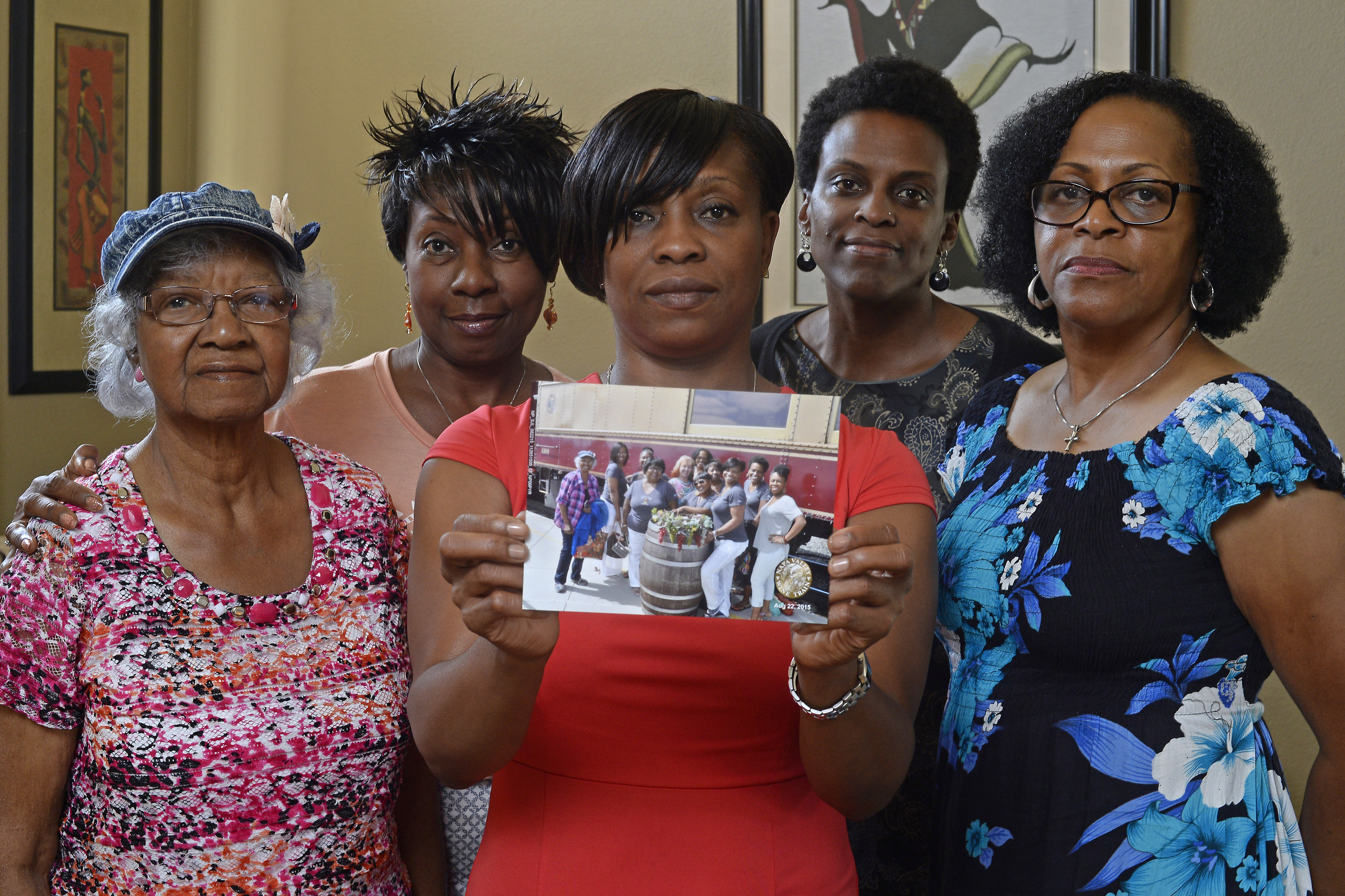 Five members of the Sistahs on the Reading Edge book club, all of Antioch, from left, Katherine Neal, Georgia Lewis, Lisa Renee Johnson, Allisa Carr and Sandra Jamerson stand together at Johnson's home in Antioch, Calif., on Aug. 24, 2015. (Jose Carlos Fajardo—AP)