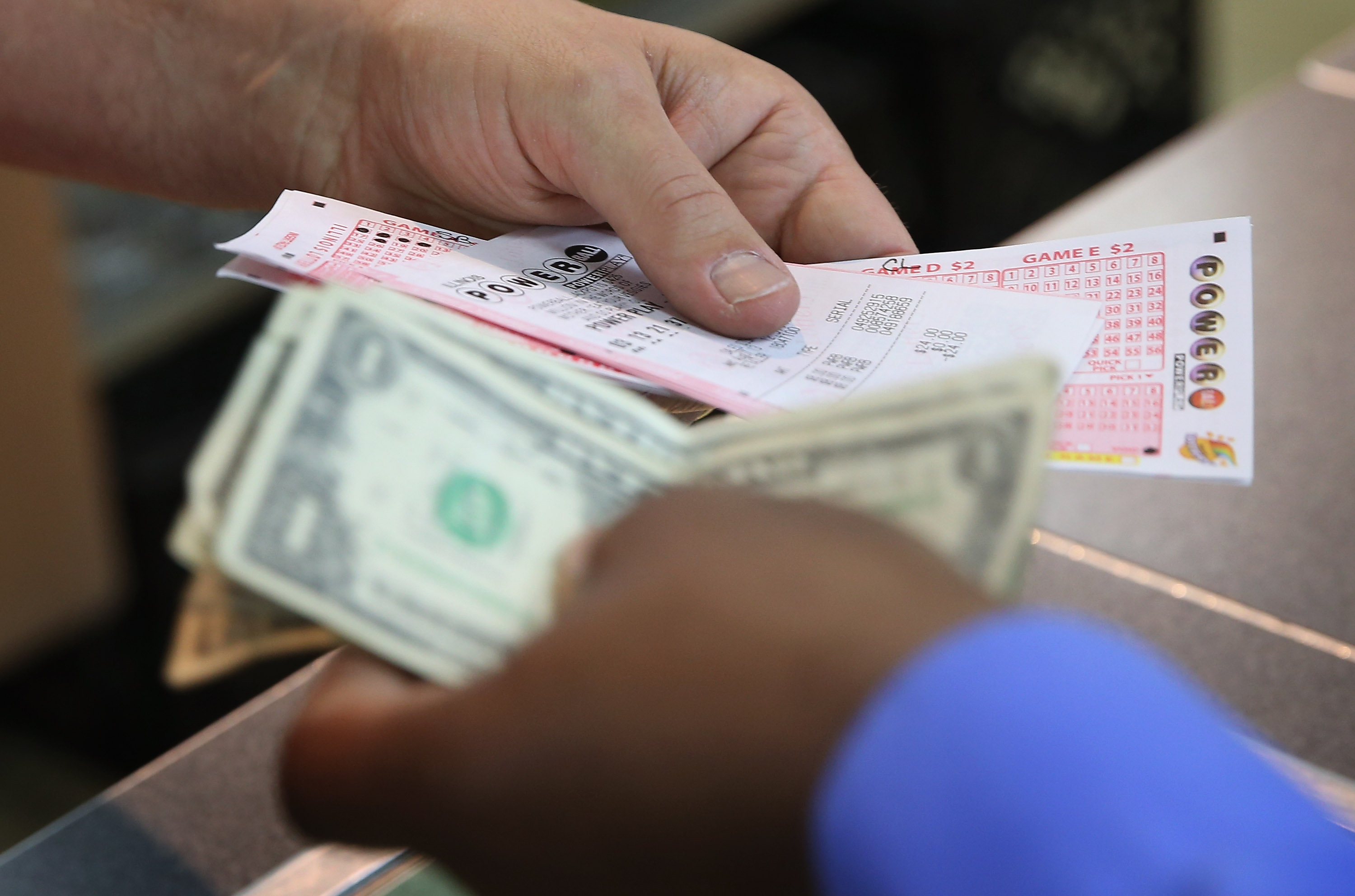 A customer purchases a Powerball lottery ticket on Aug. 7, 2013 in Chicago. (Scott Olson&mdash;Getty Images)