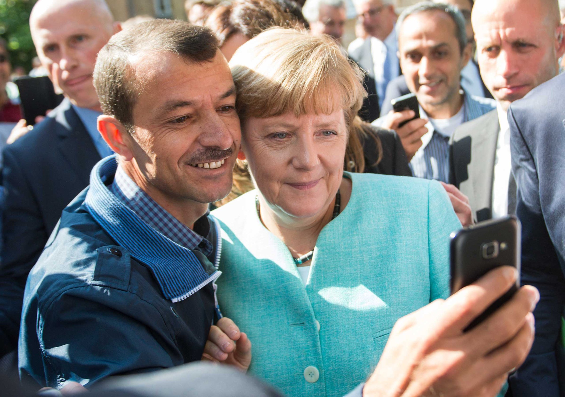 Merkel visits refugee shelter