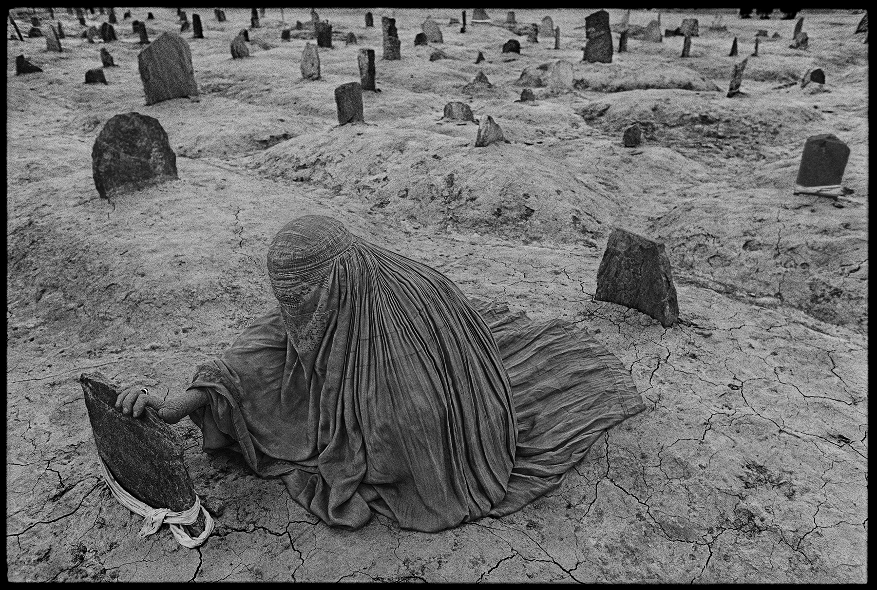 Mourning a brother killed by a Taliban rocket, Afghanistan, 1996