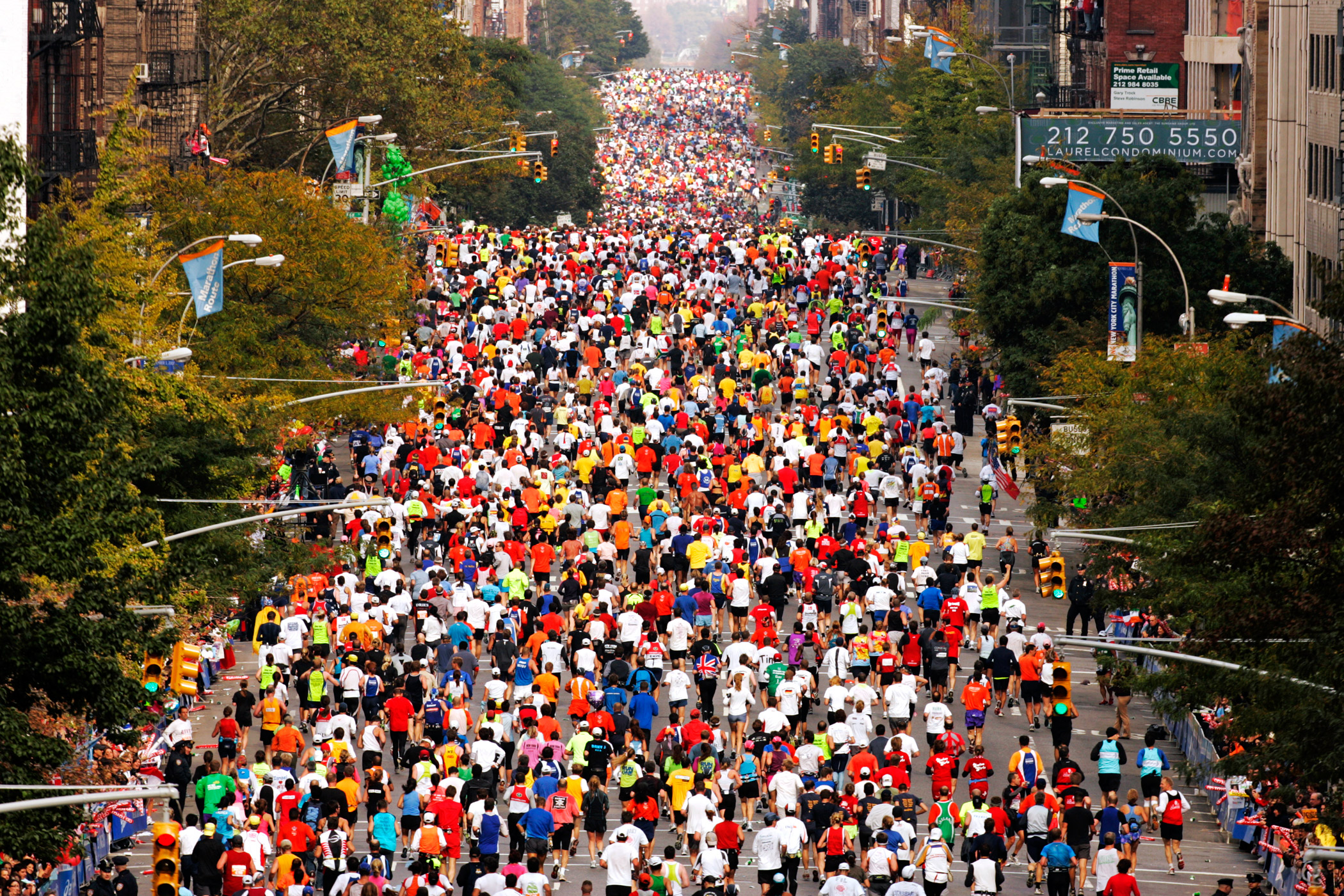 Competitors from the 'middle of the pack' run up First Avenue during the 2007 New York City Marathon.