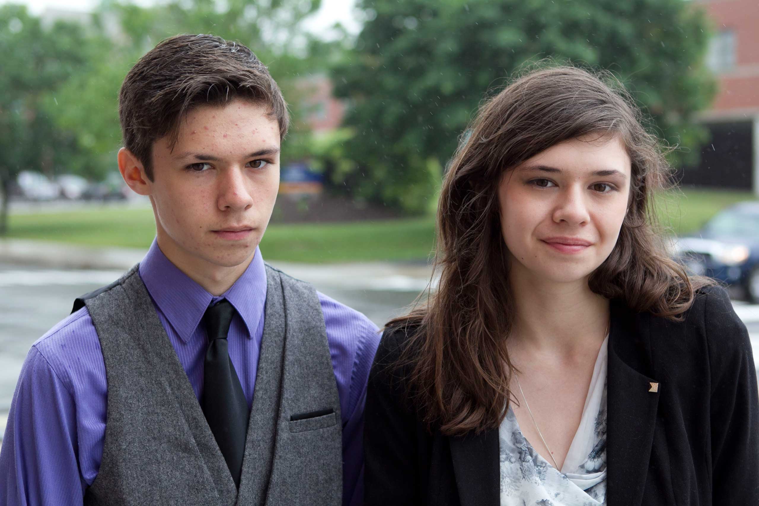 Jonas Maines, left, and his transgender sister, Nicole Maines, stand outside the Penobscot Judicial Center, in Bangor, Maine, June 12, 2013. (Robert F. Bukaty—AP)